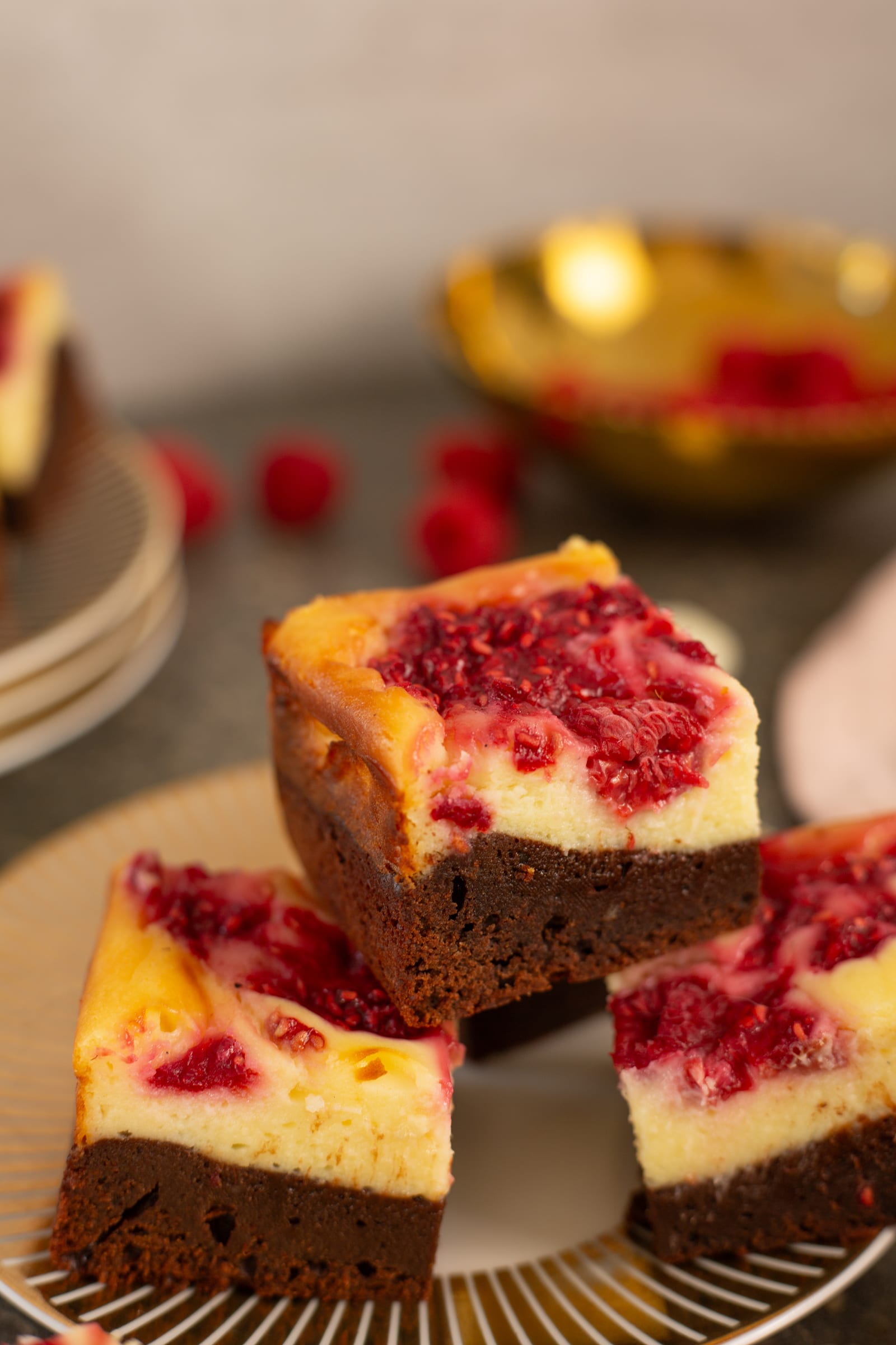 Brownie bars stacked on a plate, showing their layers
