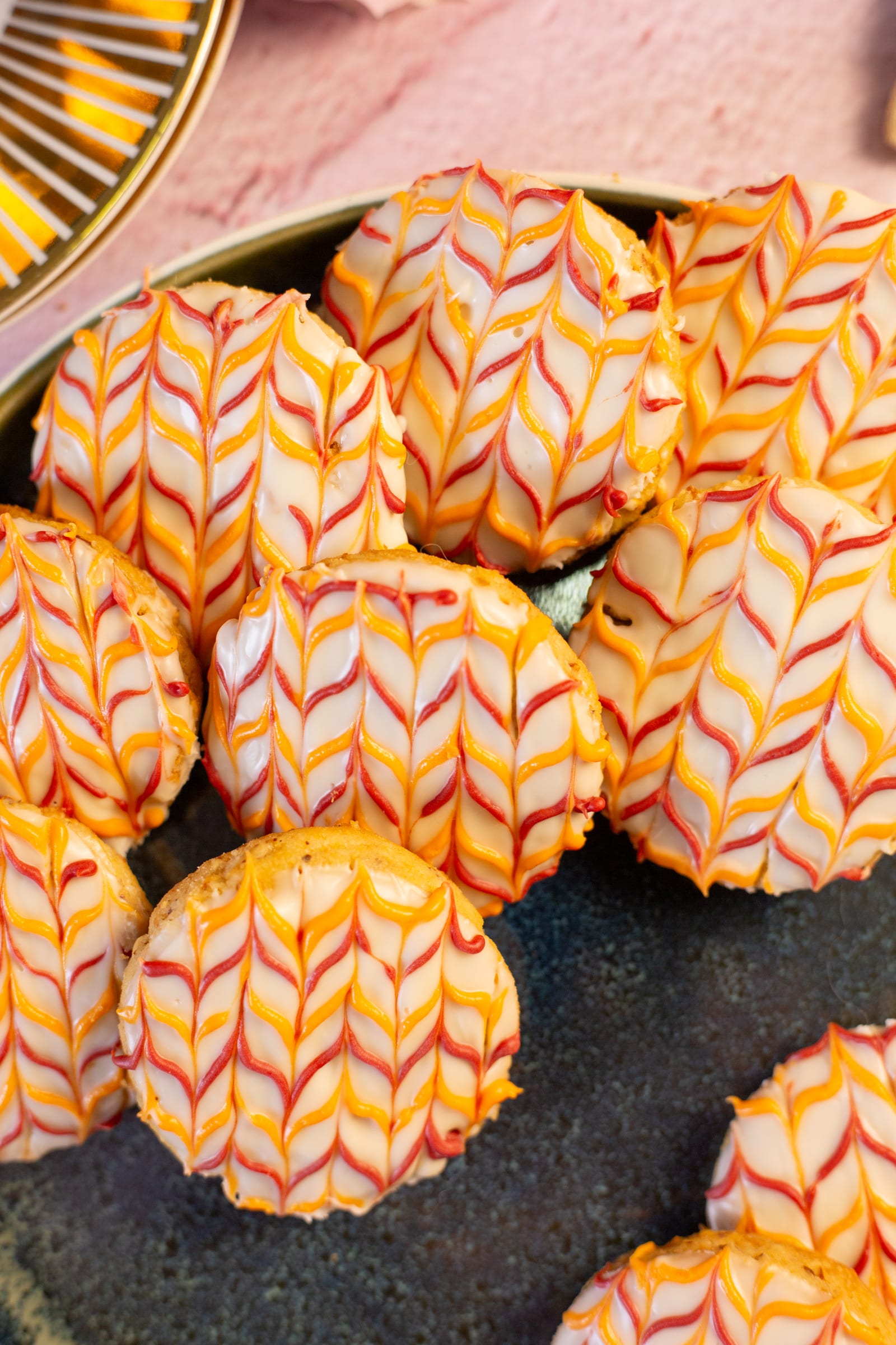A pile of iced coconut and almond biscuits