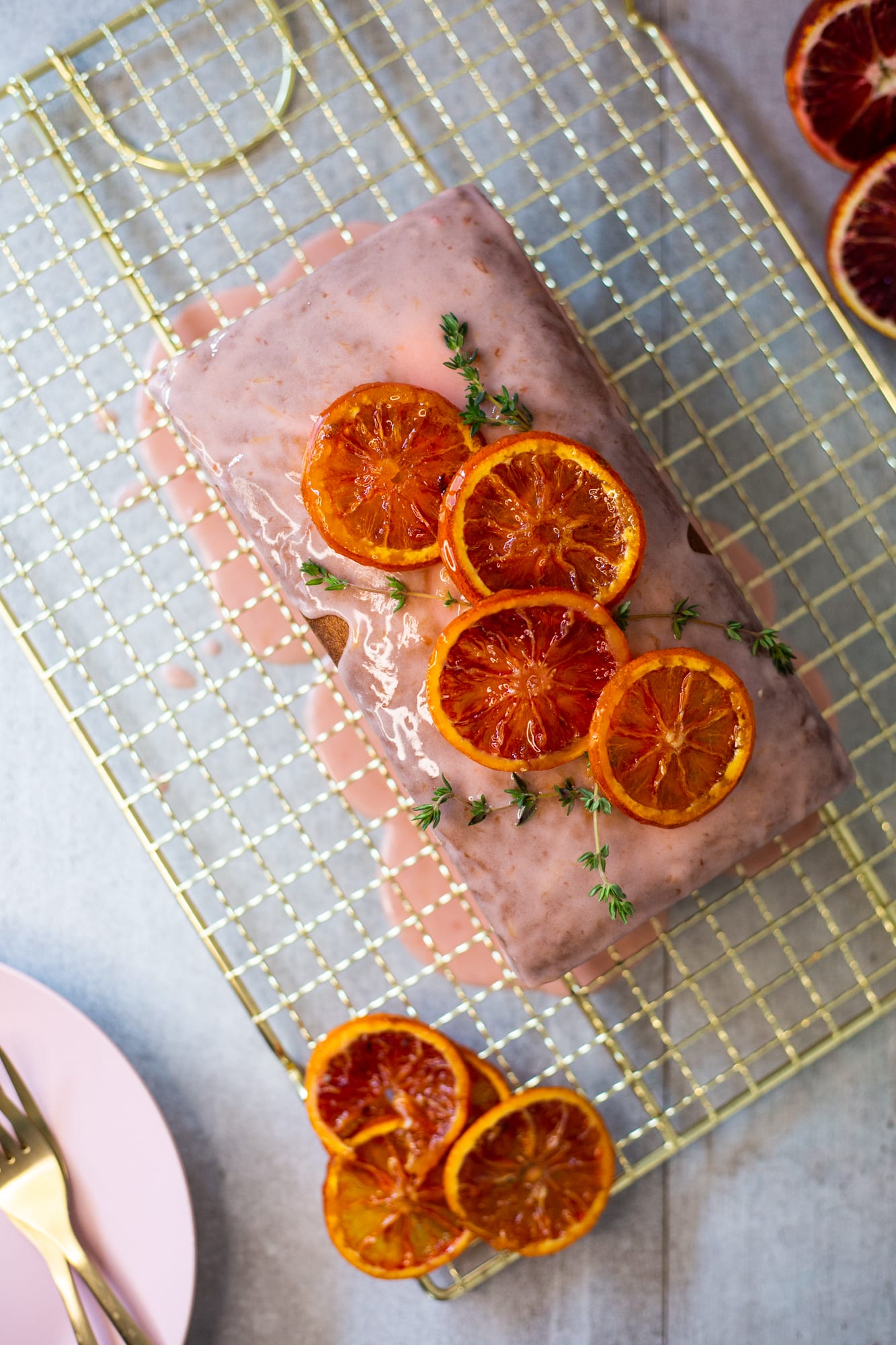 A glazed cream cheese pound cake topped with candied blood orange slices, from above