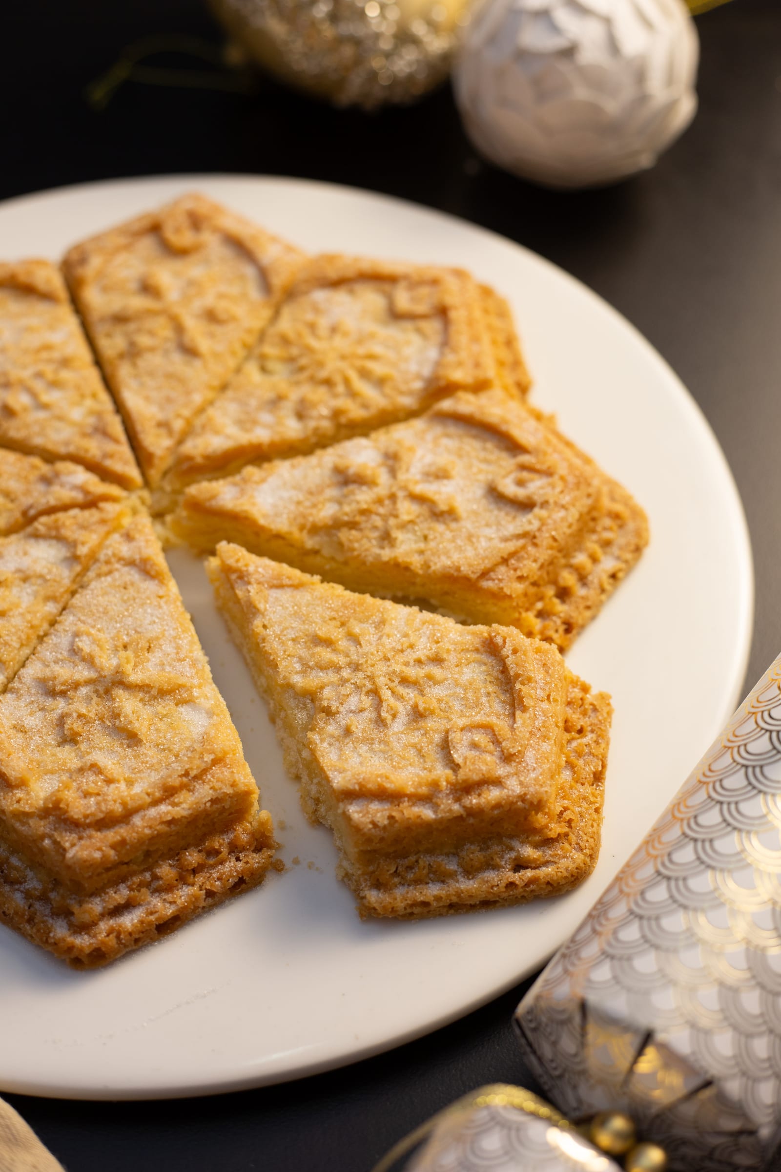 Close-up of shortbread wedges with their pressed pattern