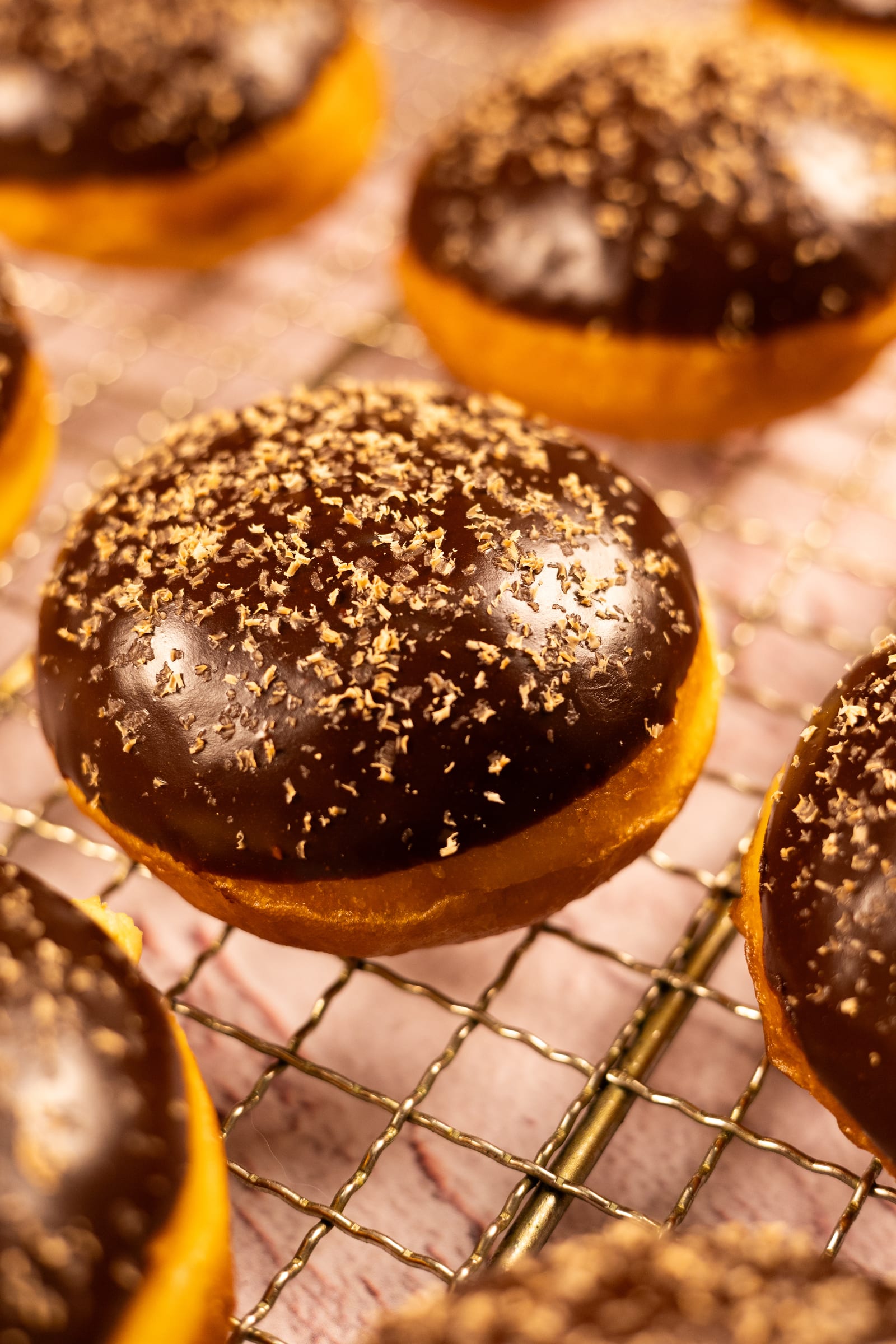 Close-up of a glossy chocolate glaze sprinkled with cinnamon sugar