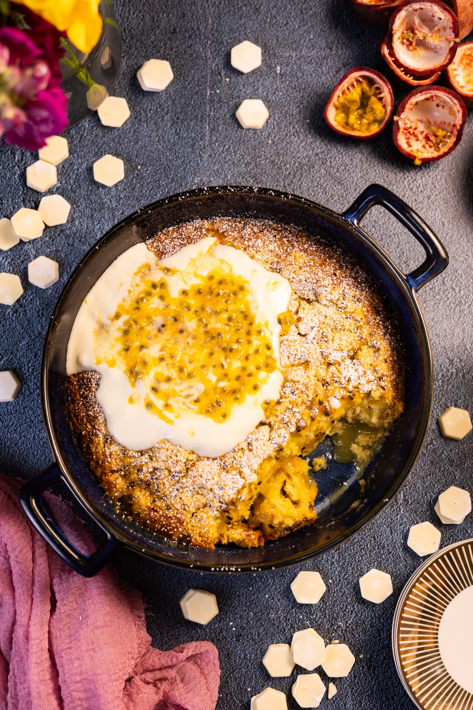 The pudding topped with coconut crème fraîche and passionfruit pulp, from above