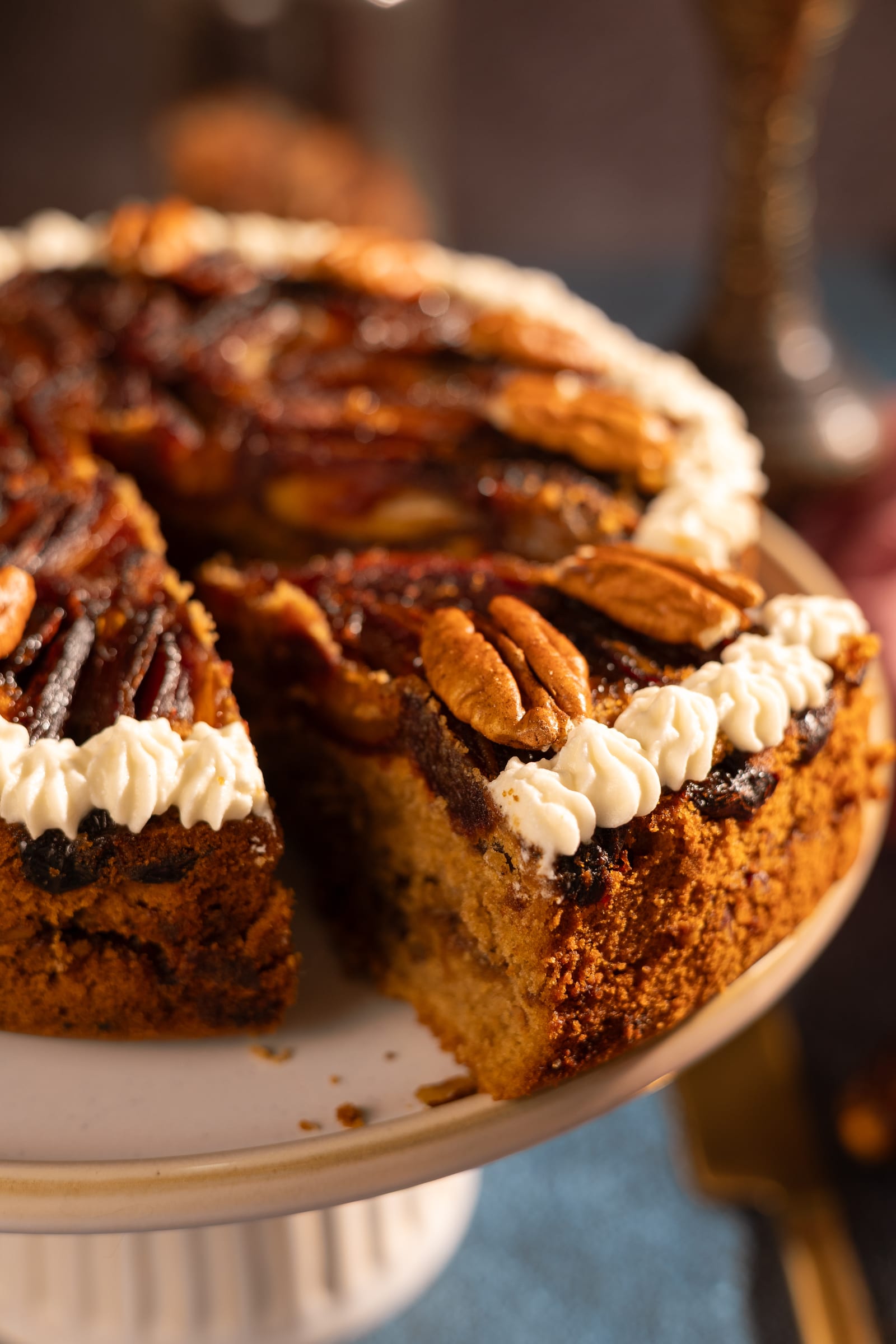 The cake with a slice cut out, showing its sticky date crumb
