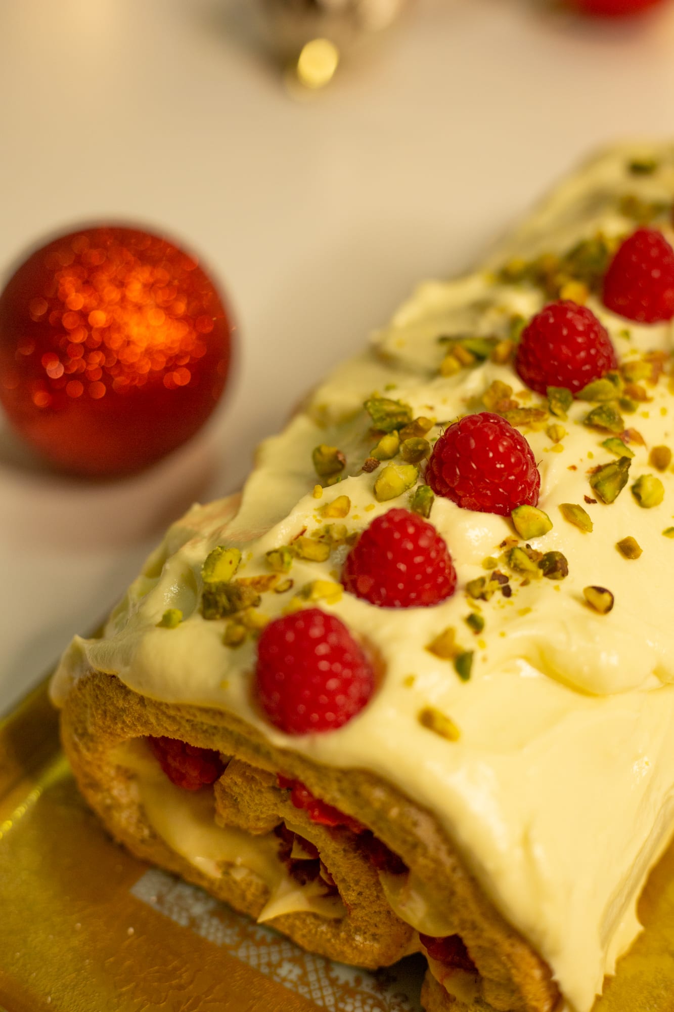 Close-up of the spiral end of a raspberry and pistachio roulade