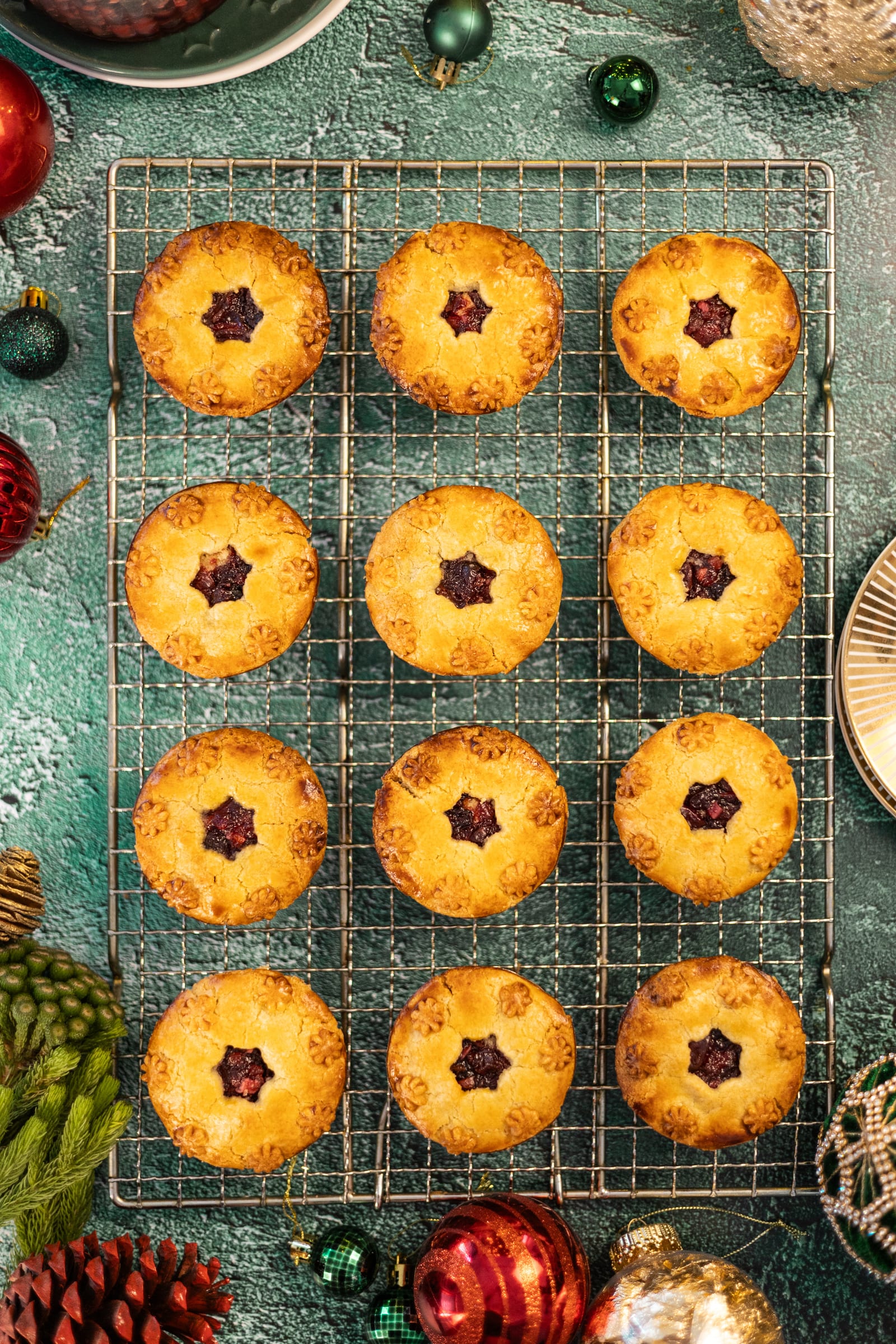 Cherry and amaretto pies cooling on a wire rack, from above