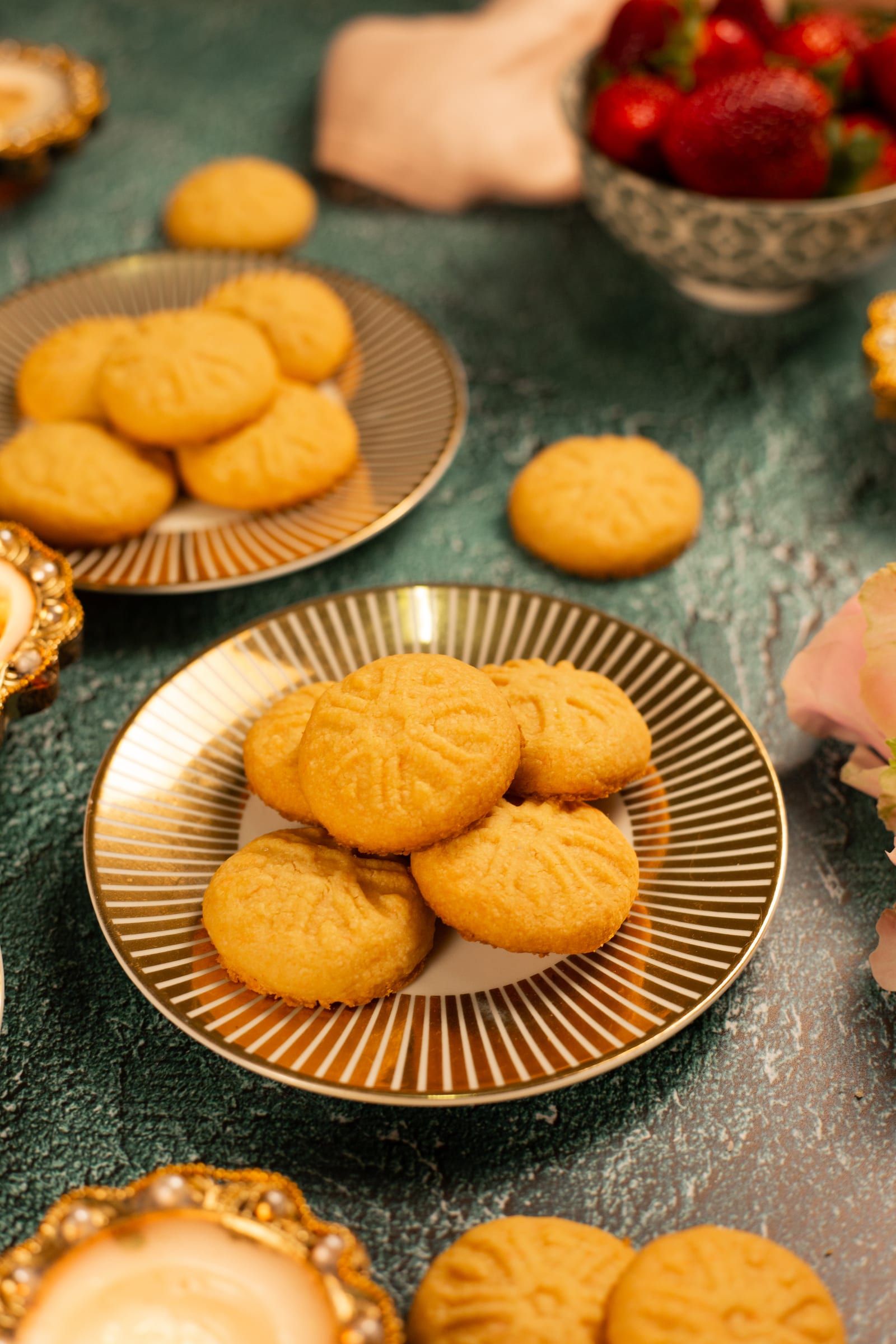 Custard biscuits piled on a gold-rimmed plate