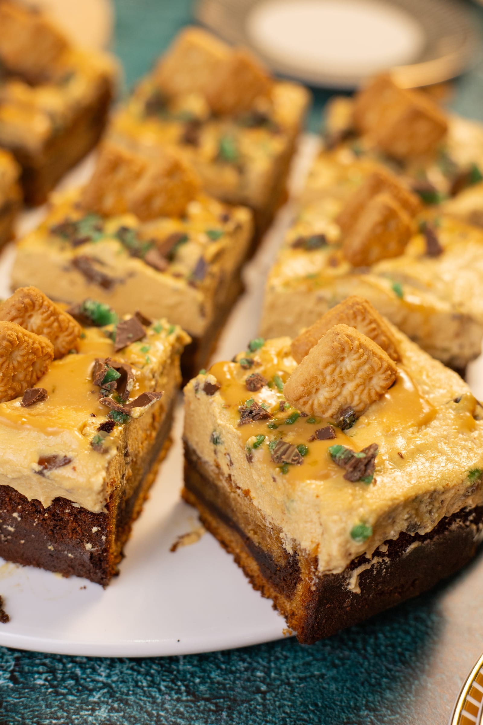 Squares of traybake showing the marbled cake under the caramel frosting