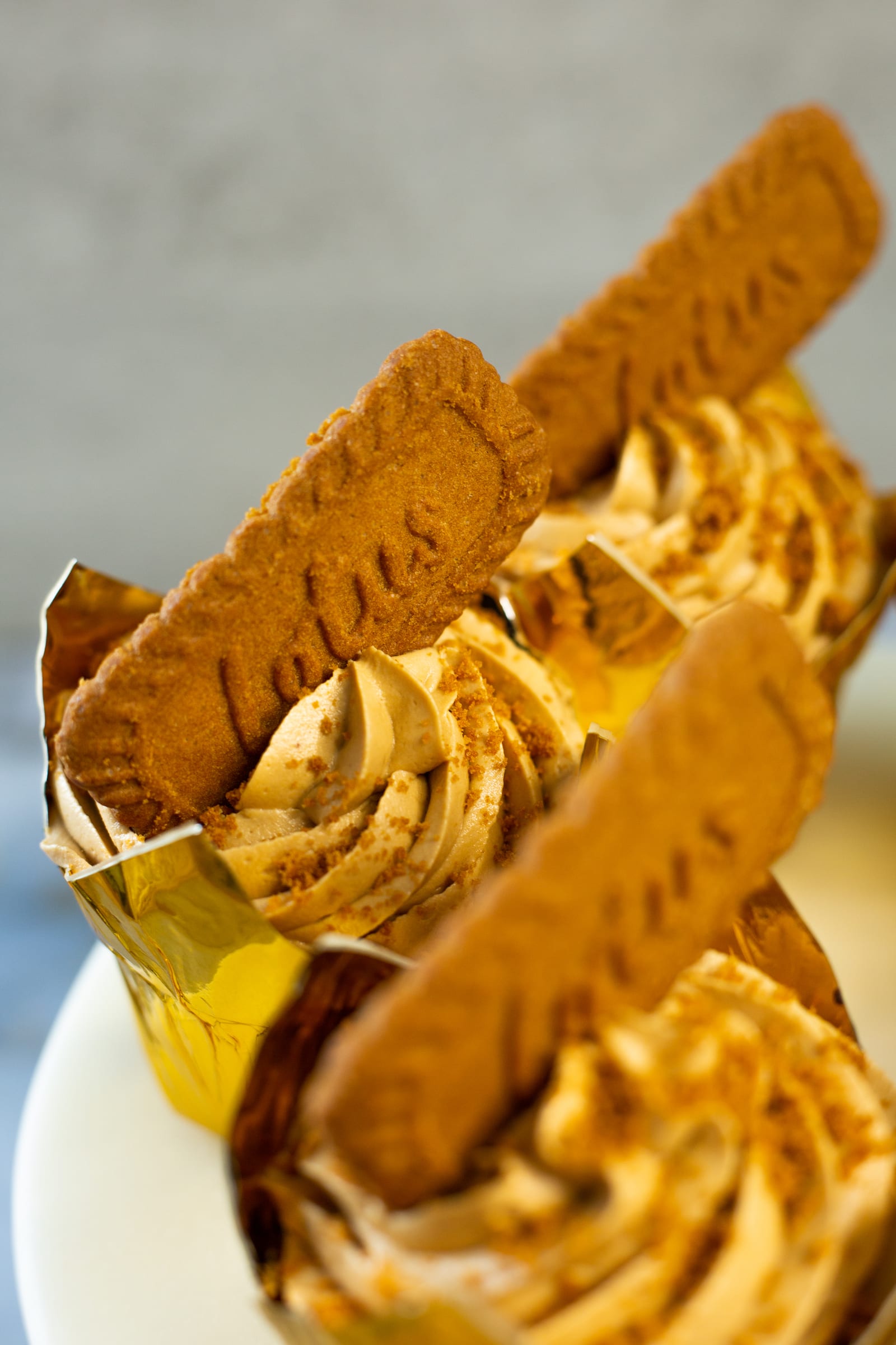 Close-up of Biscoff frosting and a Lotus biscuit on a cupcake