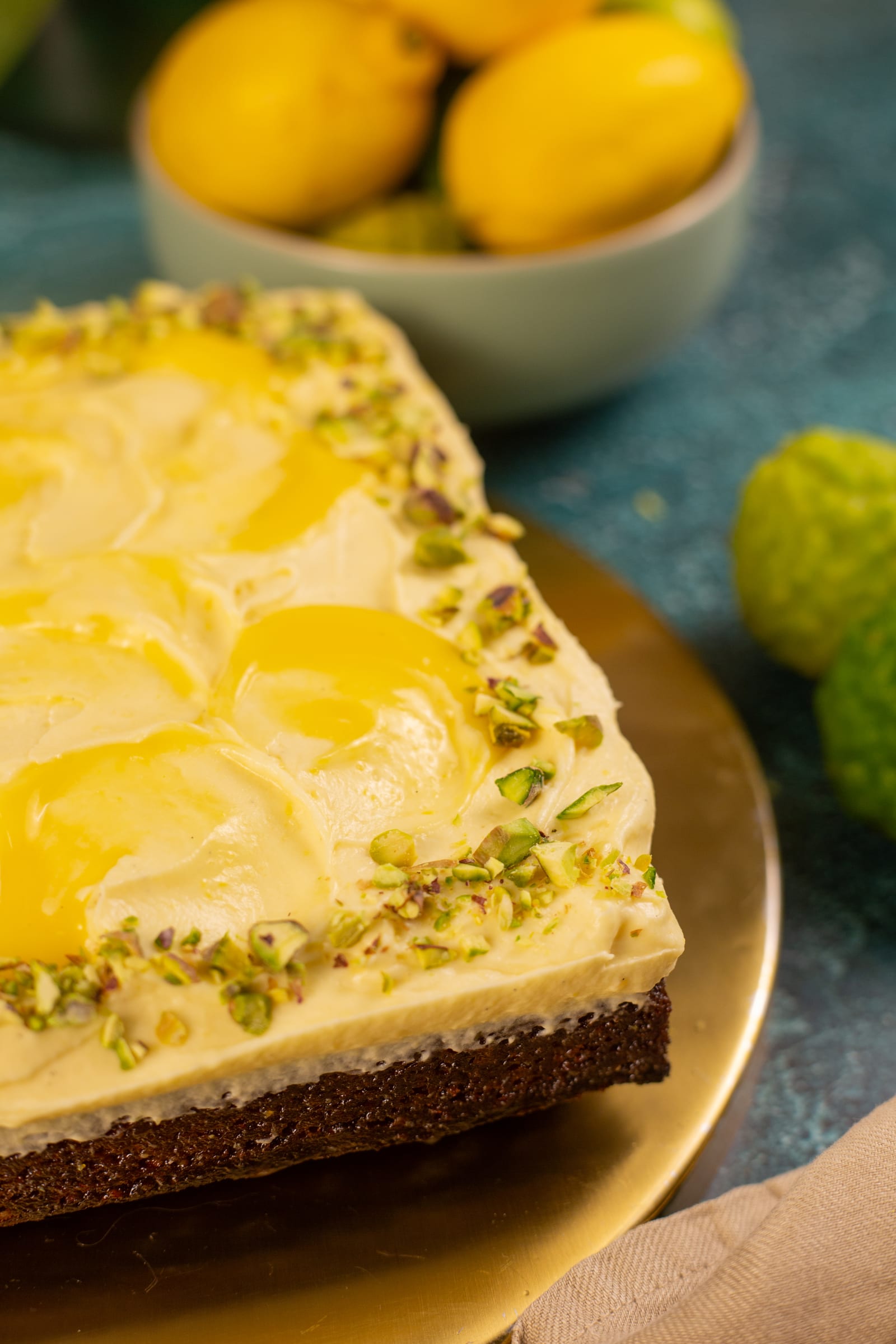 Close-up of the whipped lemon custard swirled with lemon curd and edged with chopped pistachios