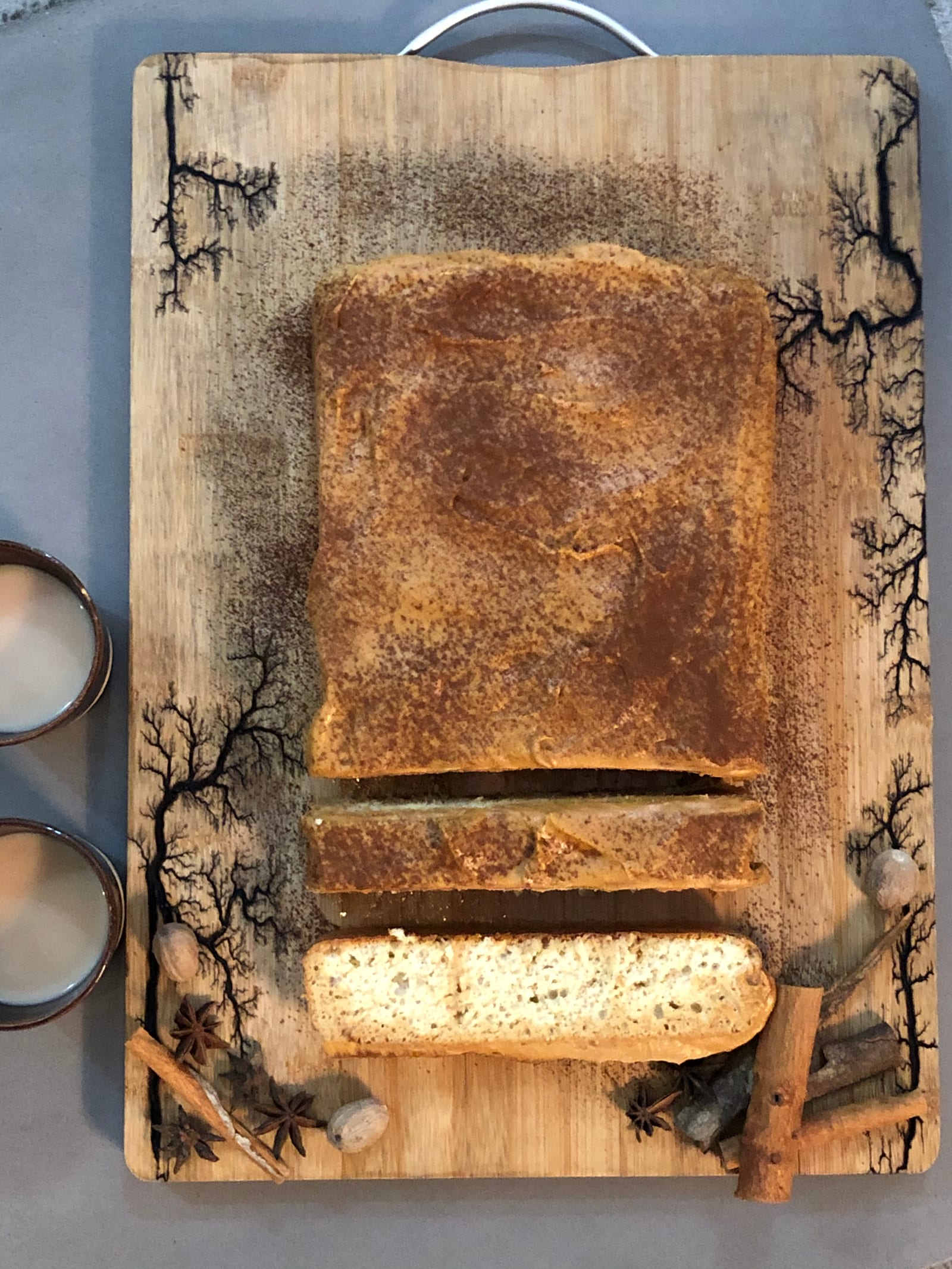 A cut masala tres leches cake with a slice pulled out, from above