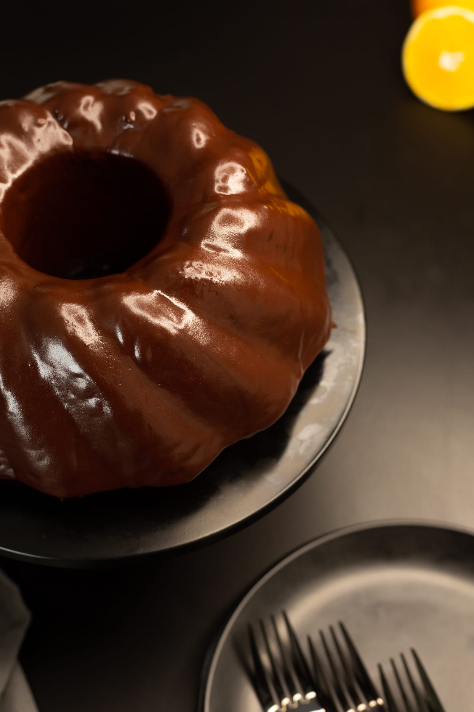 Looking down into the centre of the bundt through its glossy dark chocolate glaze