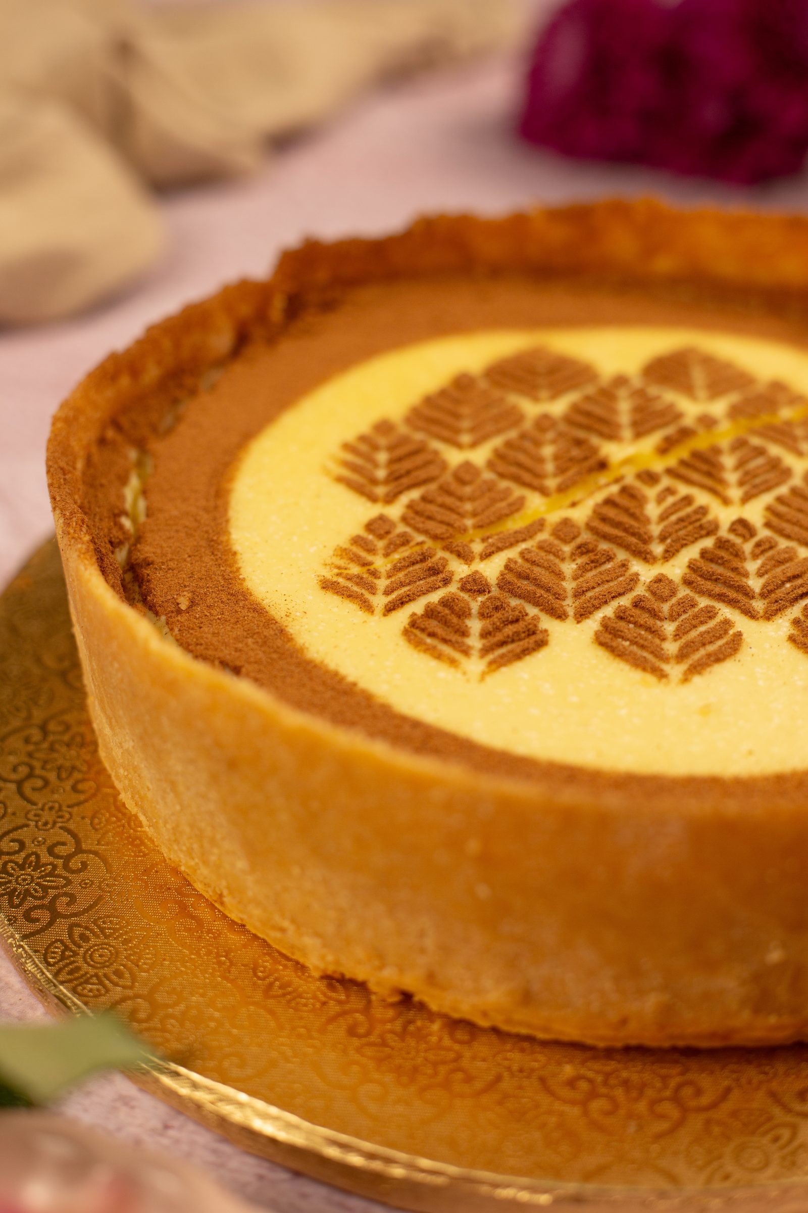 The tall biscuit crust wall of a no bake milk tart seen from the side