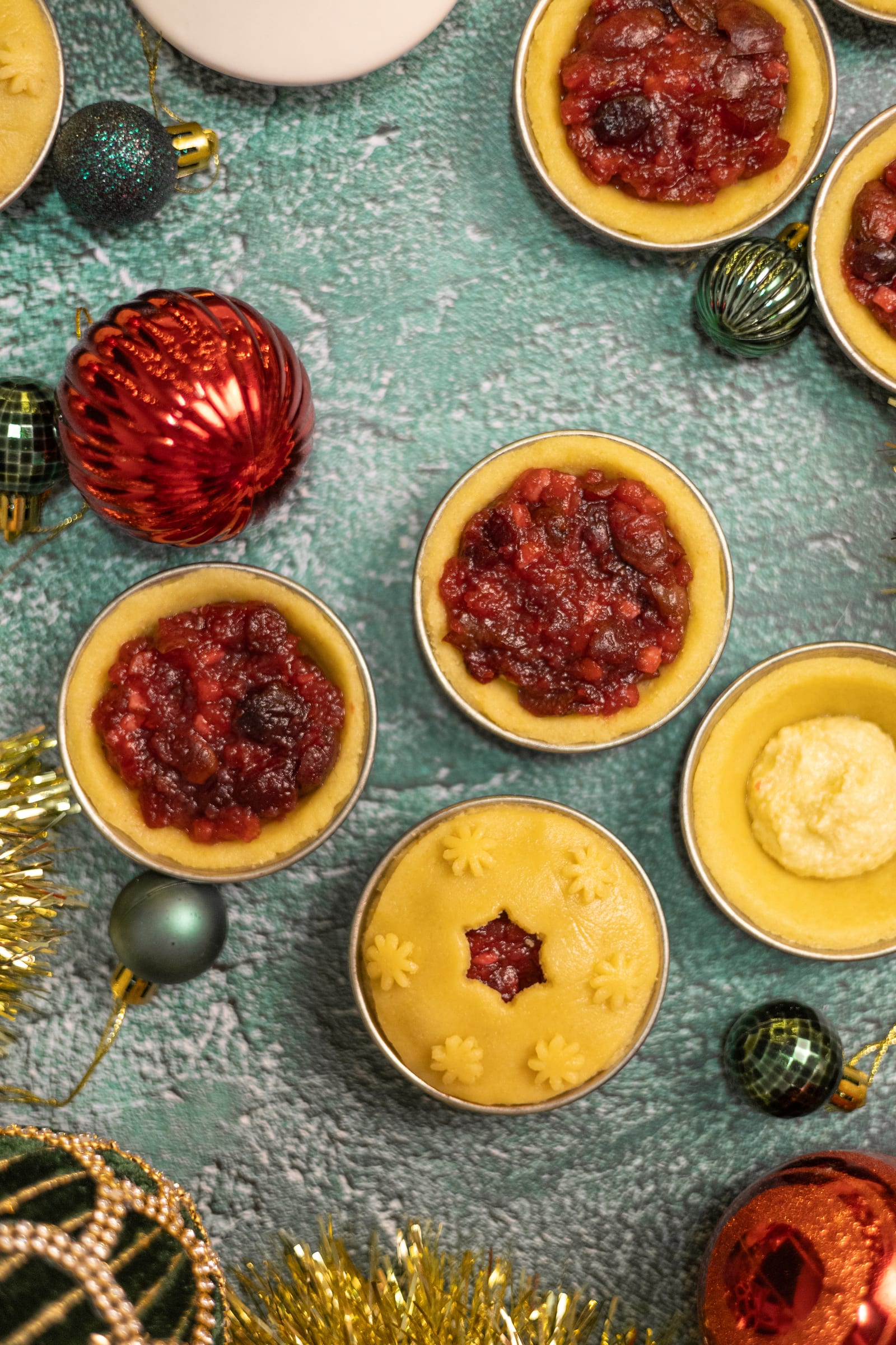Tins lined with pastry and filled with cherry filling, from above