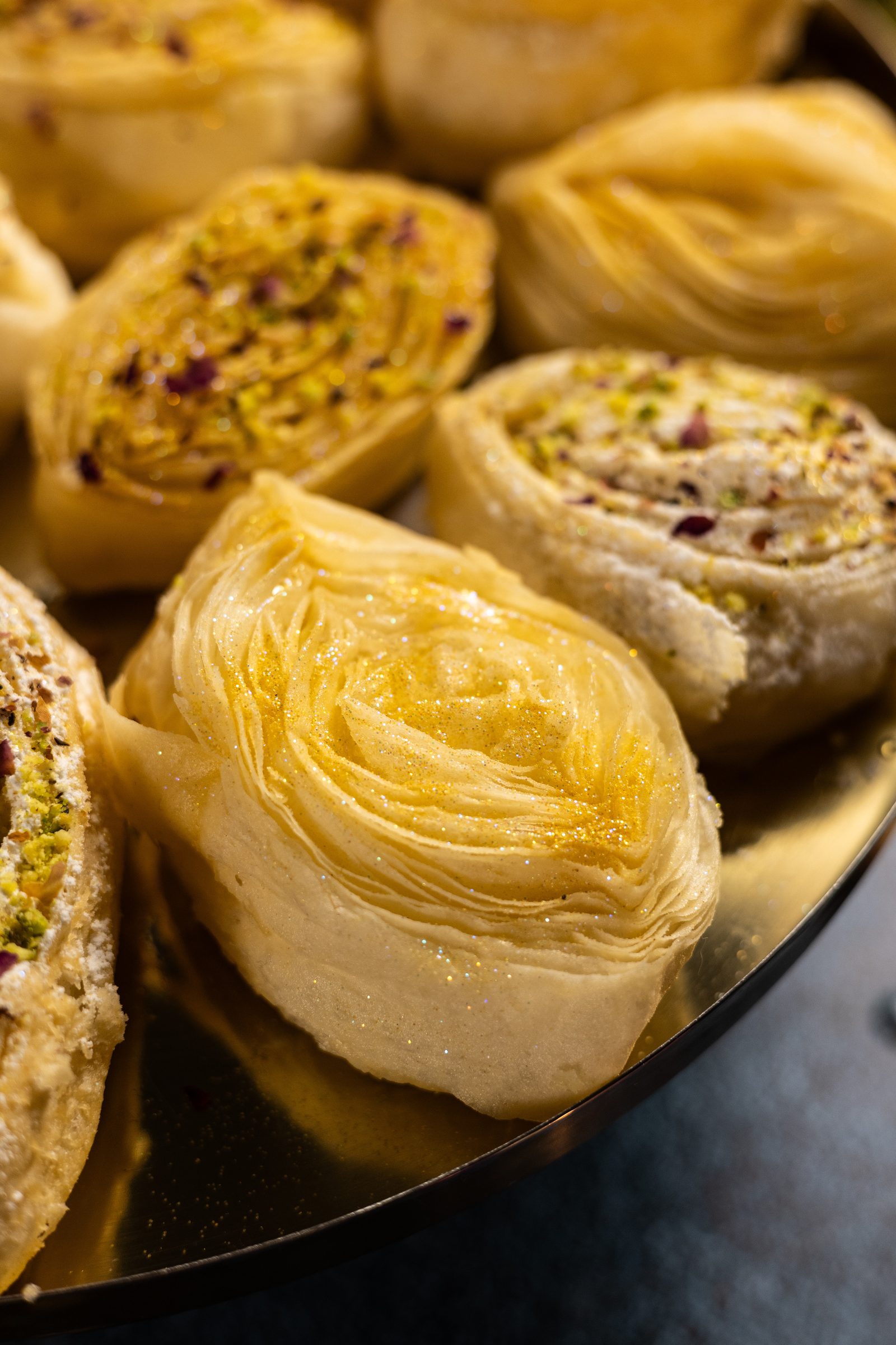 The fanned, flaky layers of a banana puri, from the side