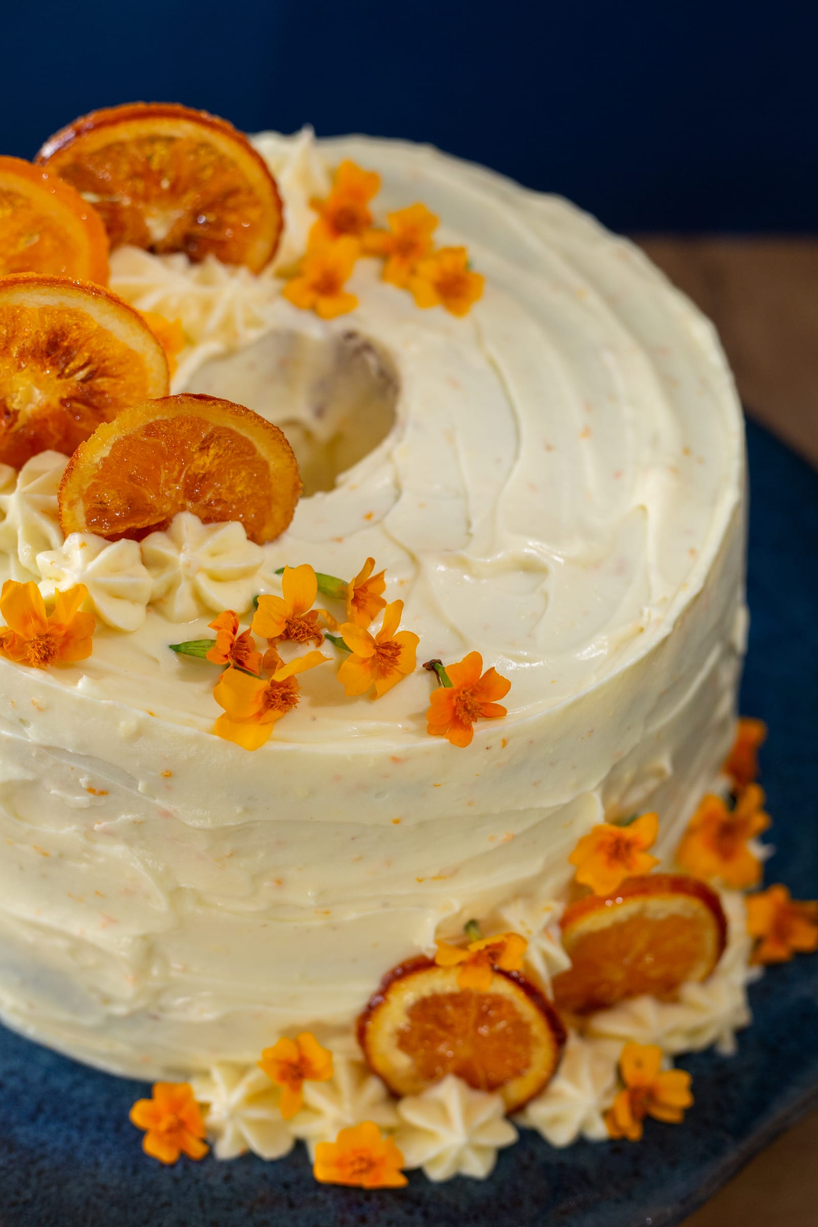 The swirled frosting and candied oranges on top of the orange cream chiffon cake, from above