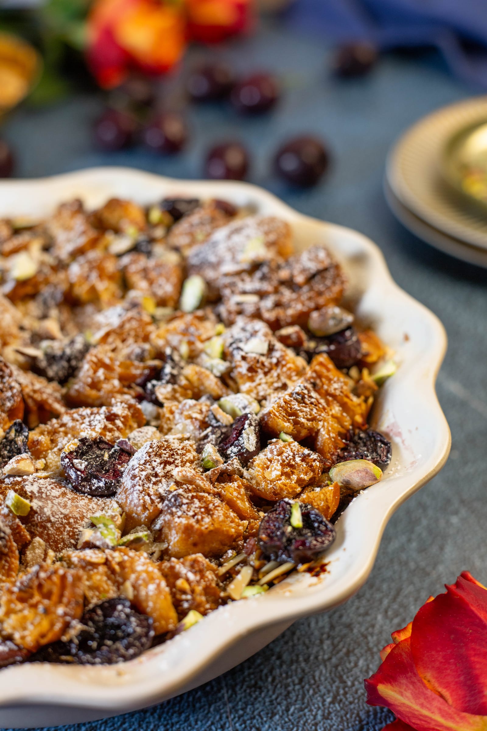 Close-up of the golden, sugar-dusted croissant pudding