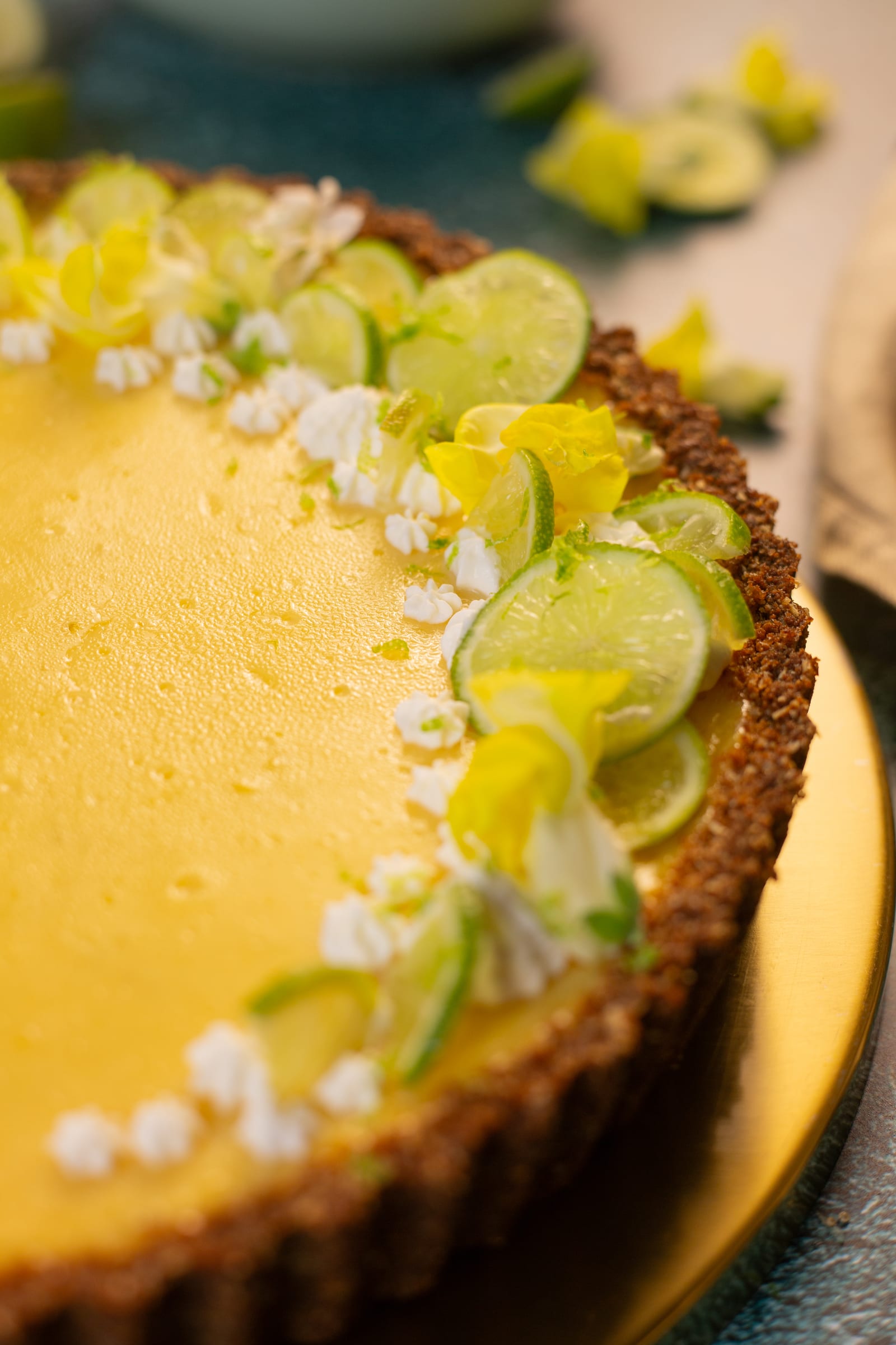 Close-up of lime slices and piped cream on the pie