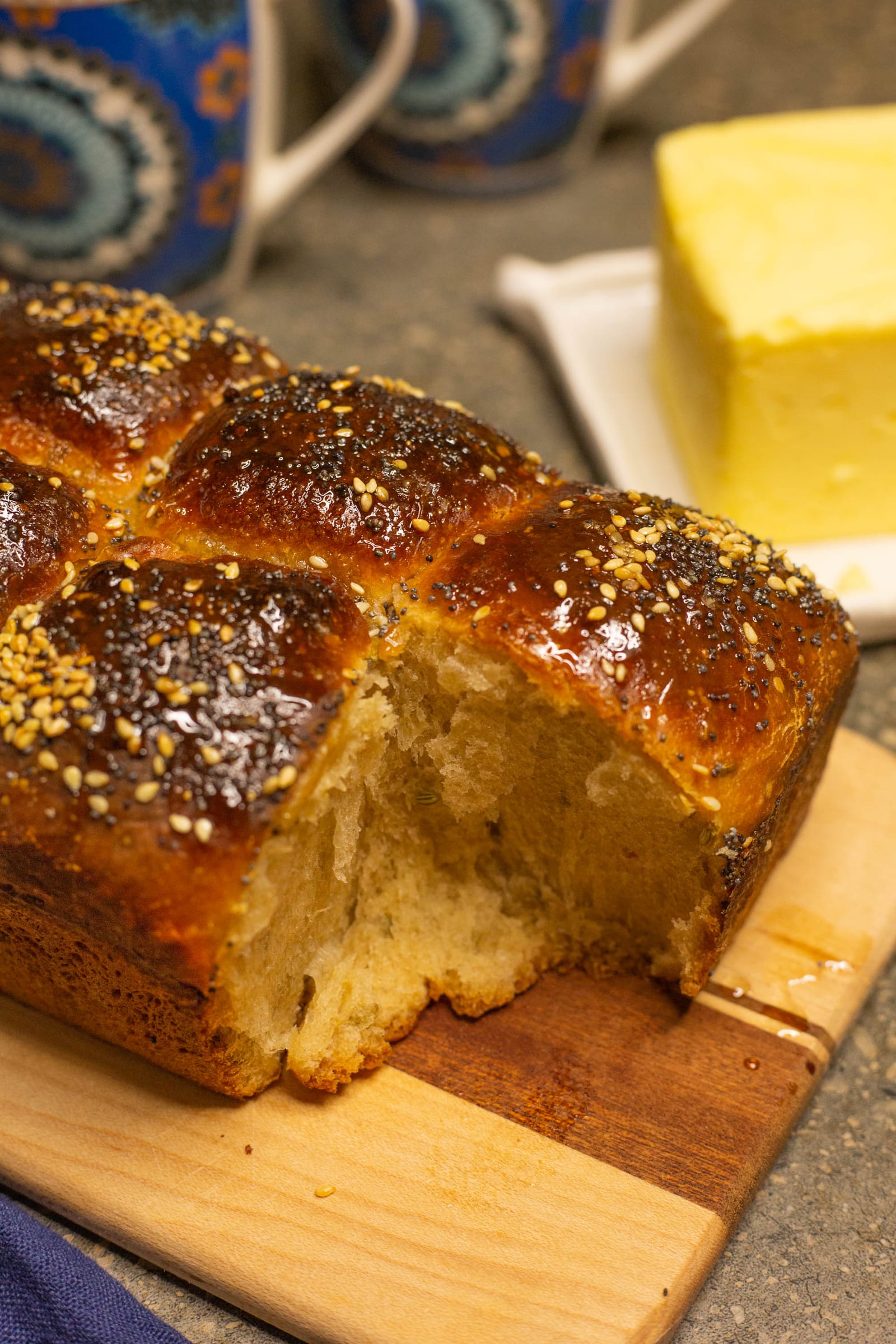 Close-up of the soft, fluffy crumb inside a seeded mosbolletjies loaf