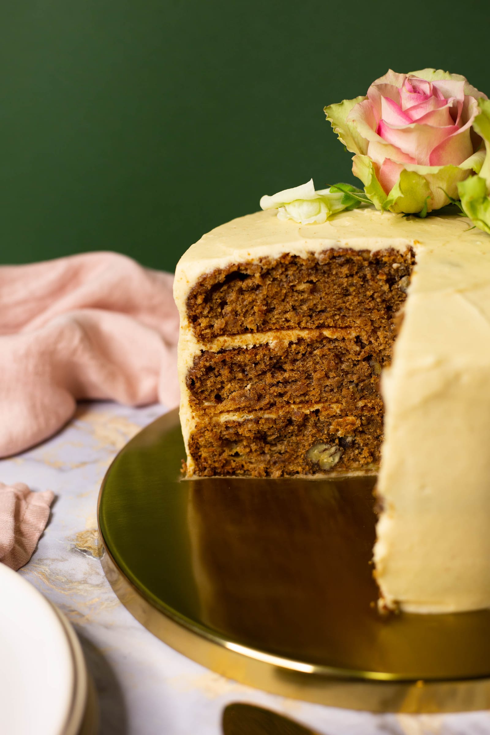 Close-up of the cut face of a hummingbird cake, showing the layers and frosting