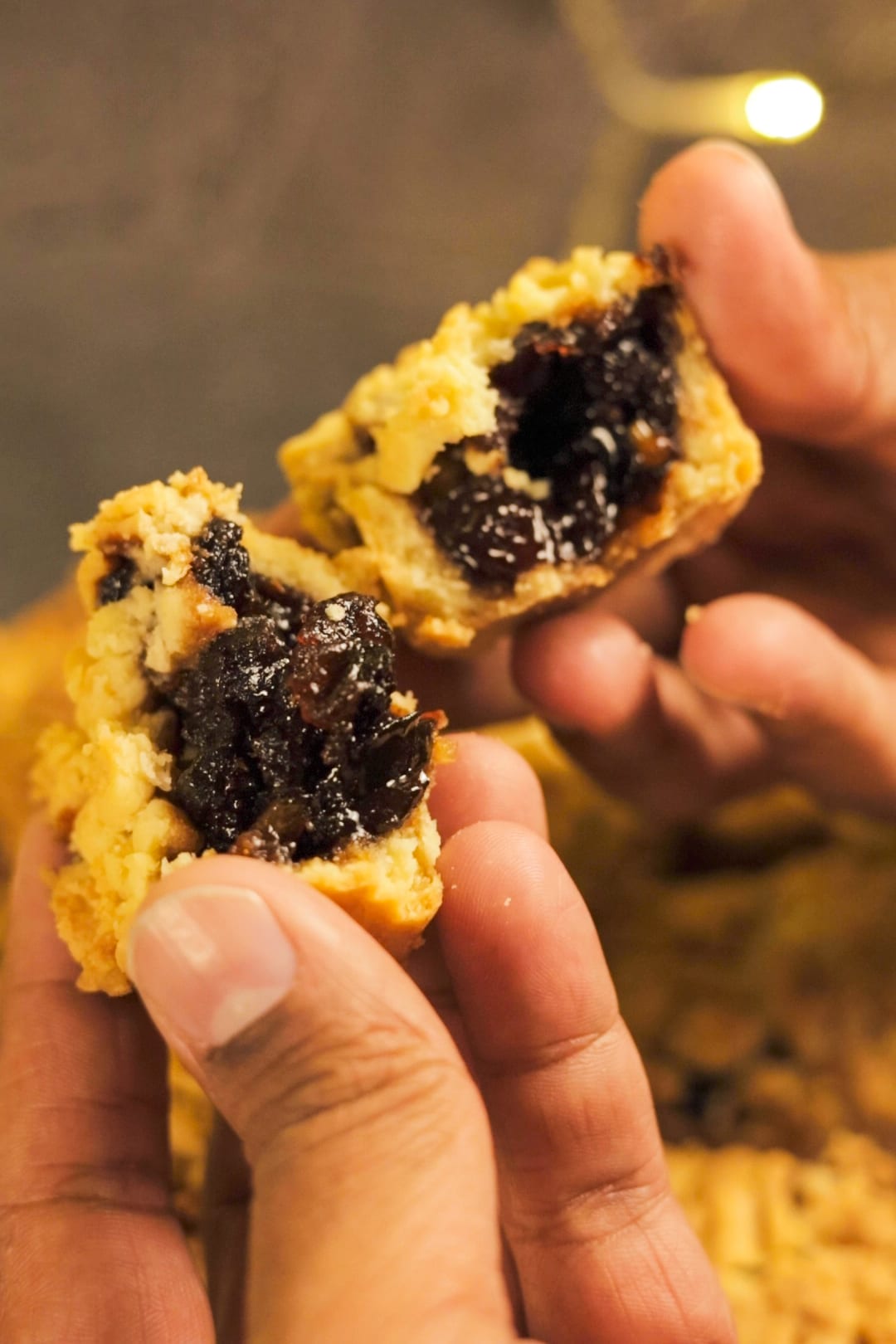 A mince pie broken open to show the fruit mince filling