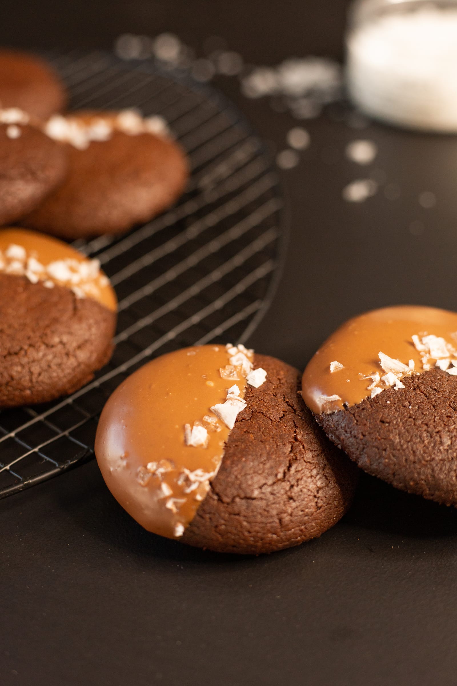 Close-up of rye brownie cookies with a salt jar behind