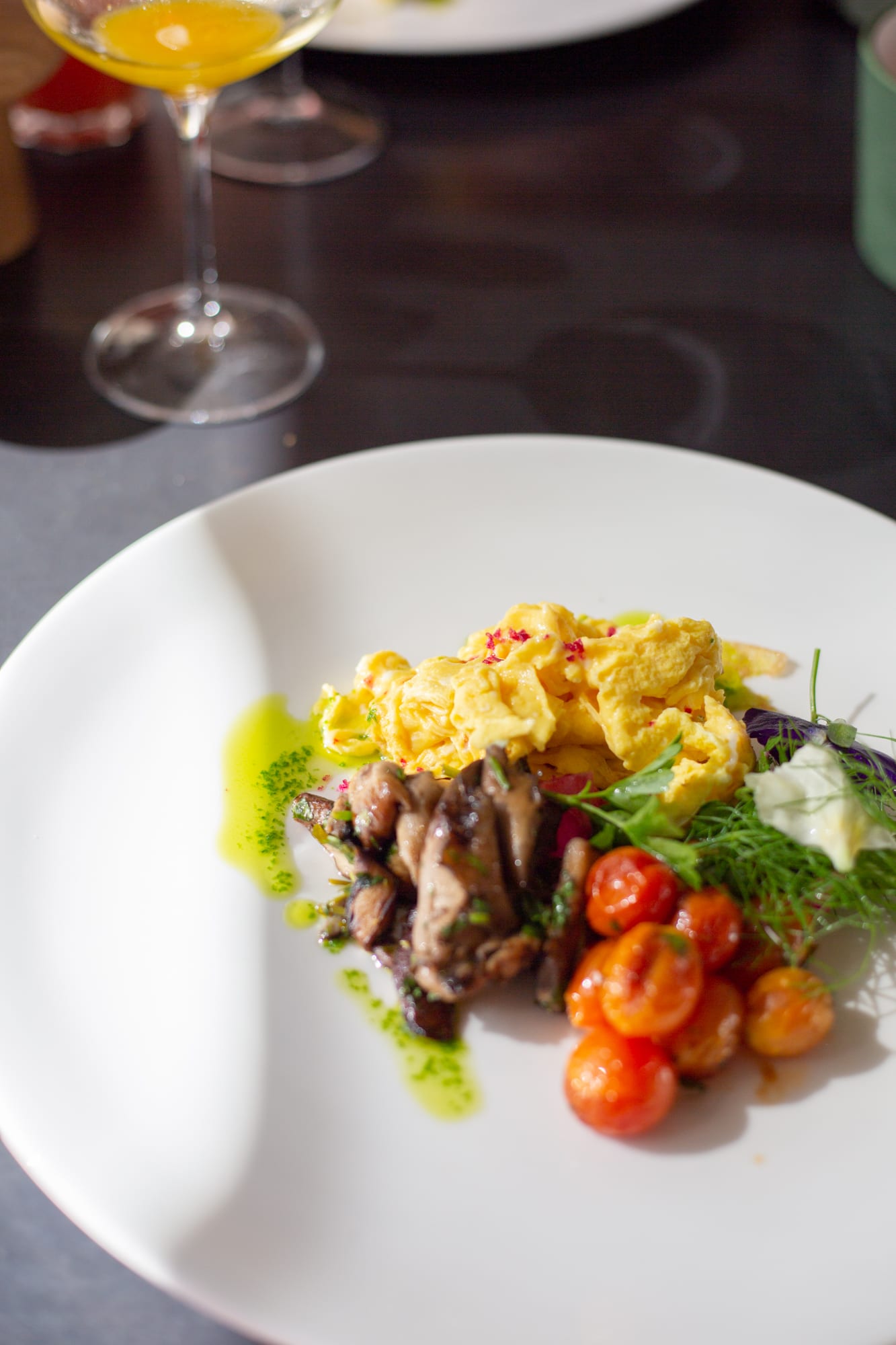 The hot breakfast course at Babel: scrambled eggs, sautéed mushrooms, roasted cherry tomatoes and greens with a drizzle of herb oil