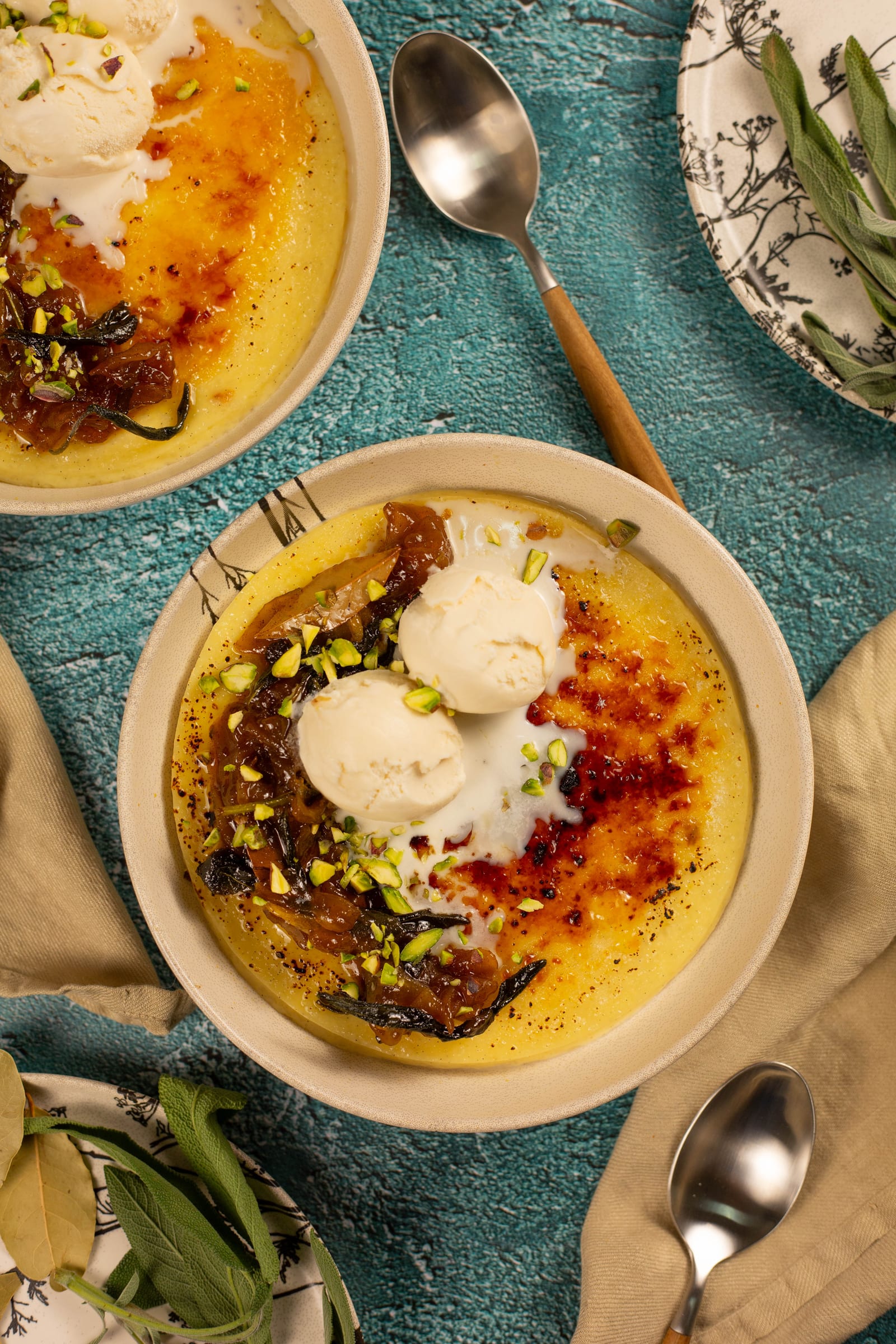 Bowls of rice pudding with fried apples and sage, from above
