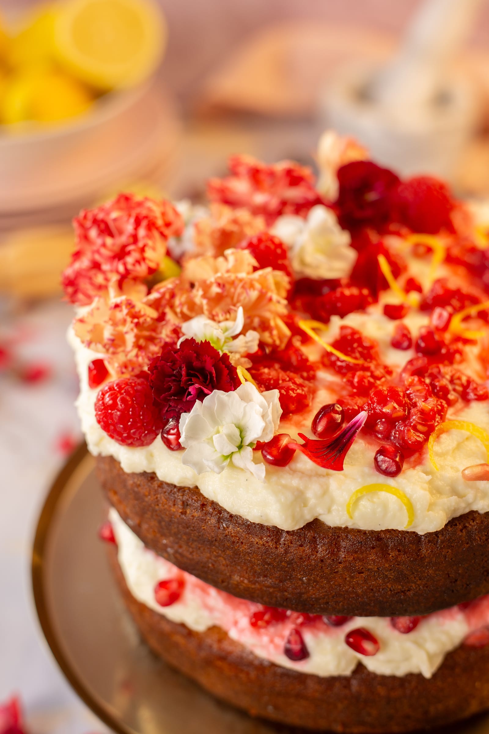 Close-up of white chocolate labneh ganache, raspberries and rose petals