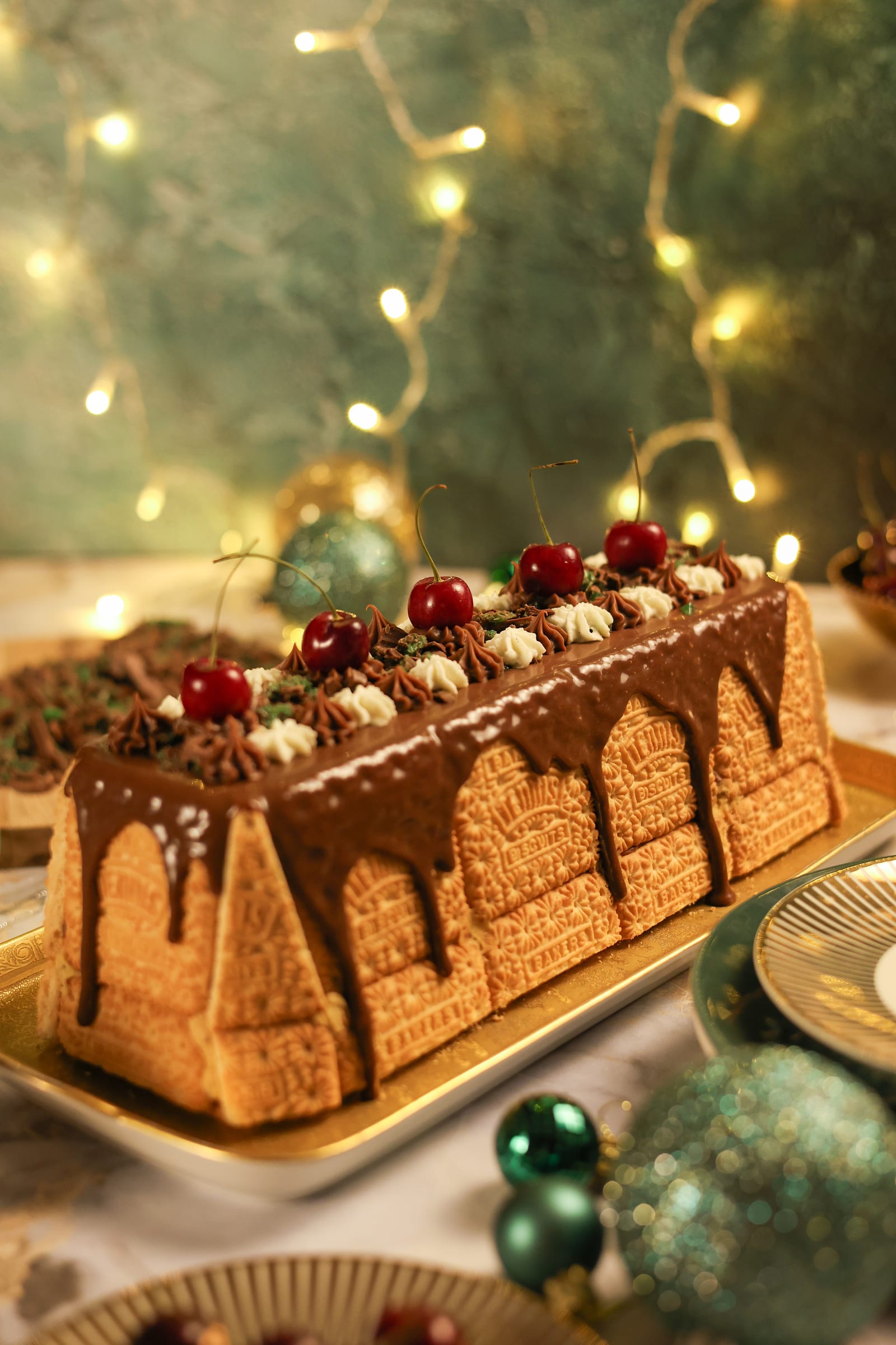 The peppermint crisp showstopper on a gold tray, with Christmas decorations