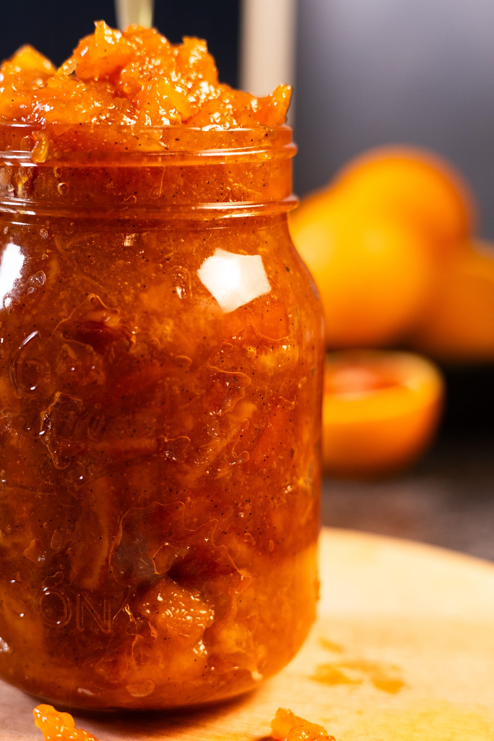 Close-up of a jar filled to the brim with thick-cut marmalade