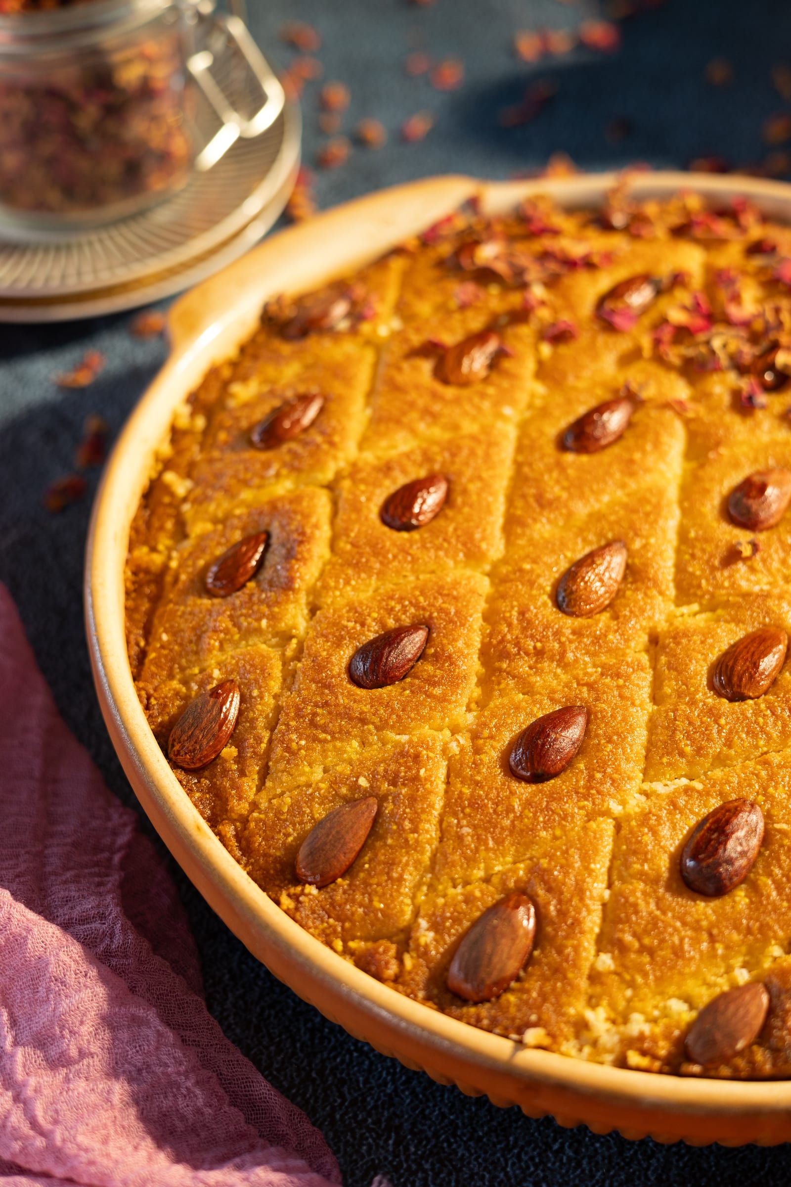 The whole basbousa in its dish, glistening with syrup