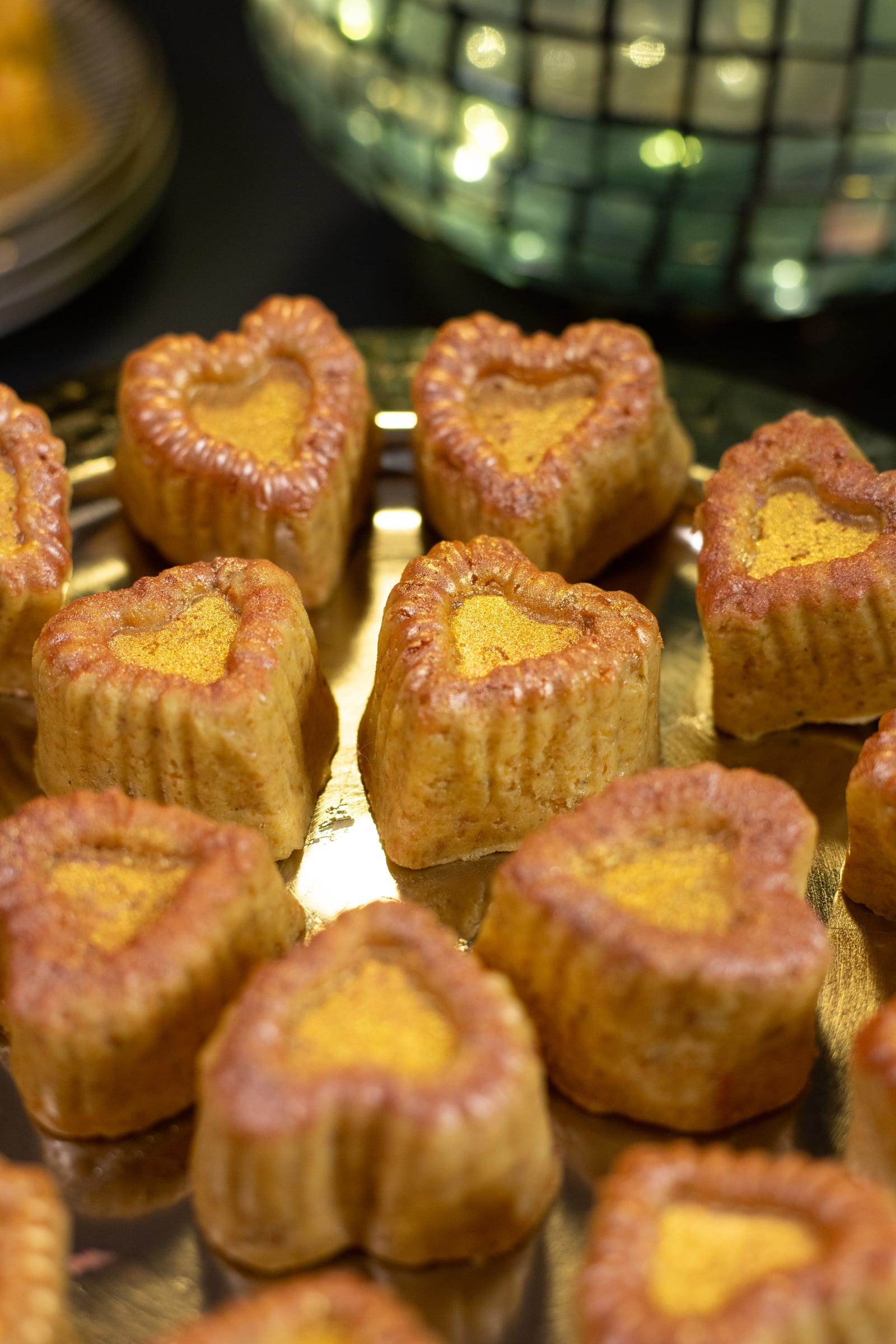 Close-up of moulded channa magaj hearts showing their ridged edges and toasty golden tops