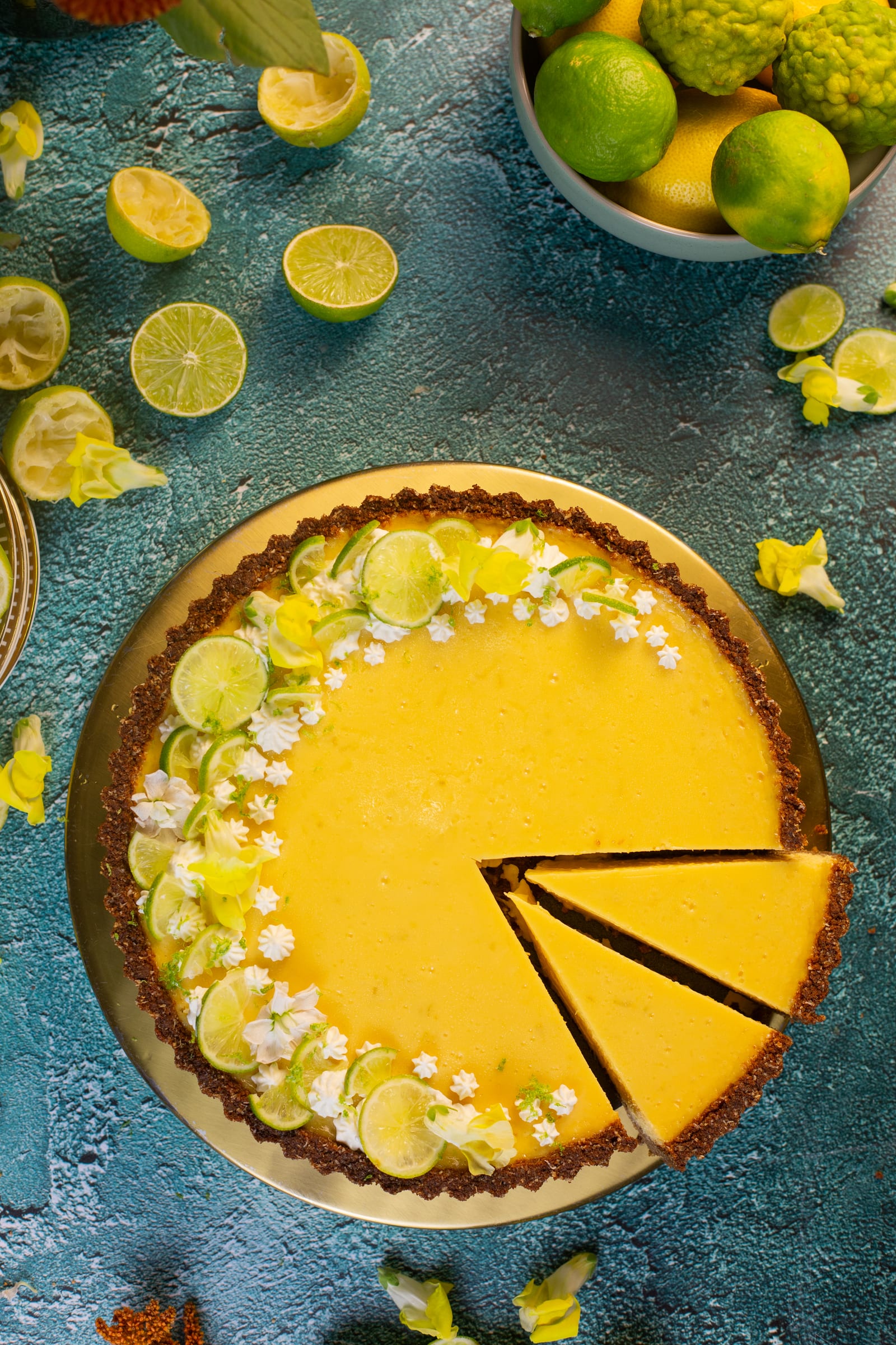 The key lime pie with a slice cut out, from above