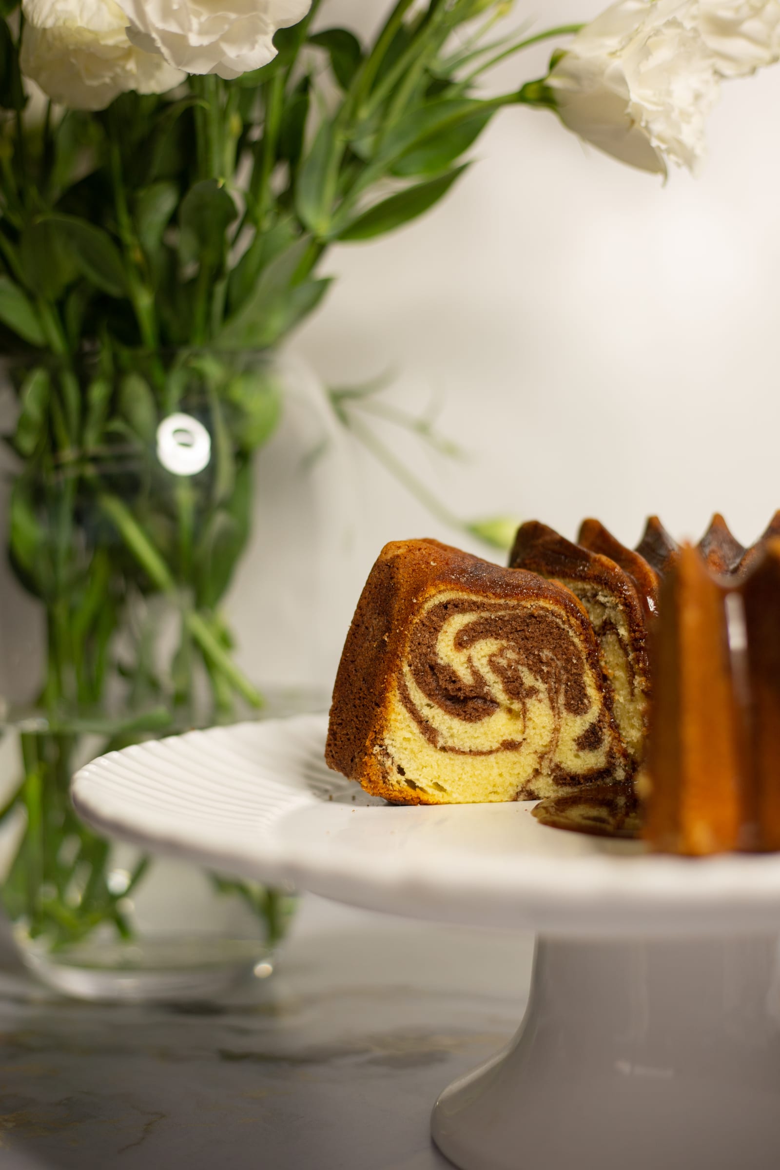 Close-up of the cut marble pound cake showing the chocolate and vanilla swirl