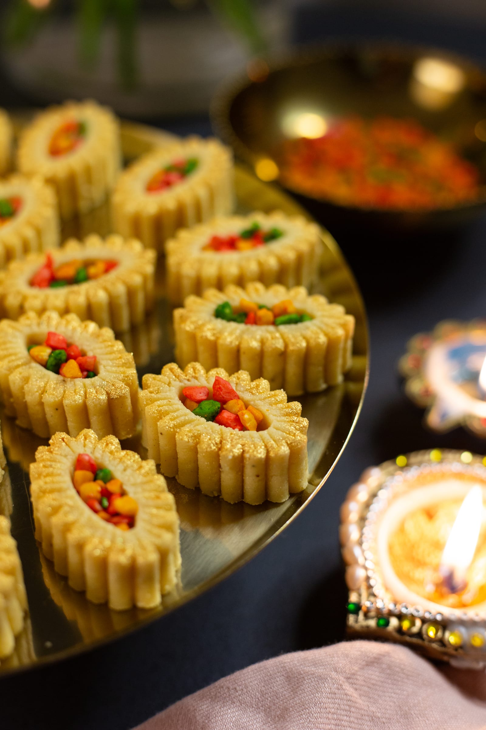 Close-up of fresh cream burfee ovals with their colourful nut filling