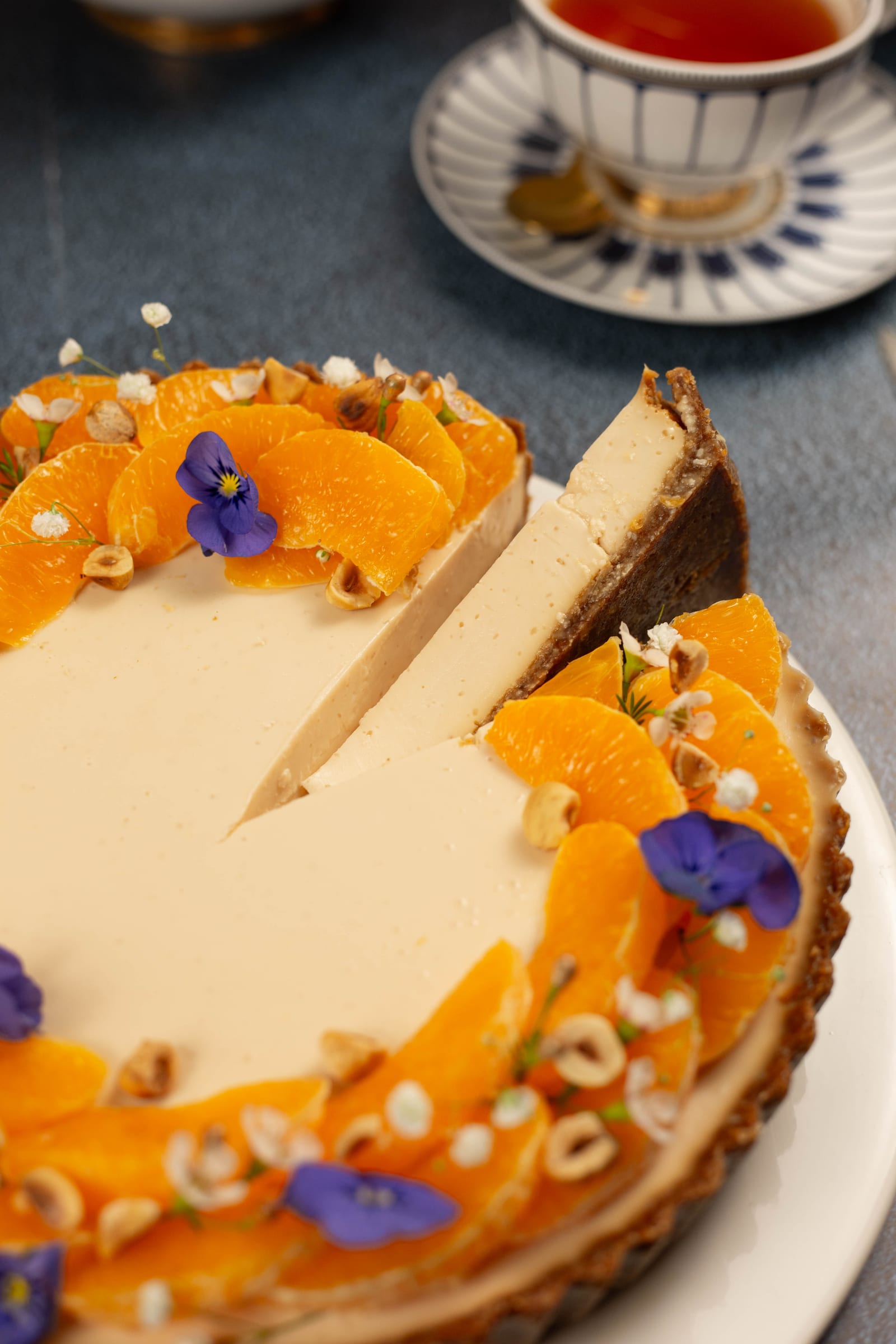 The tart with a slice cut out, showing the creamy panna cotta
