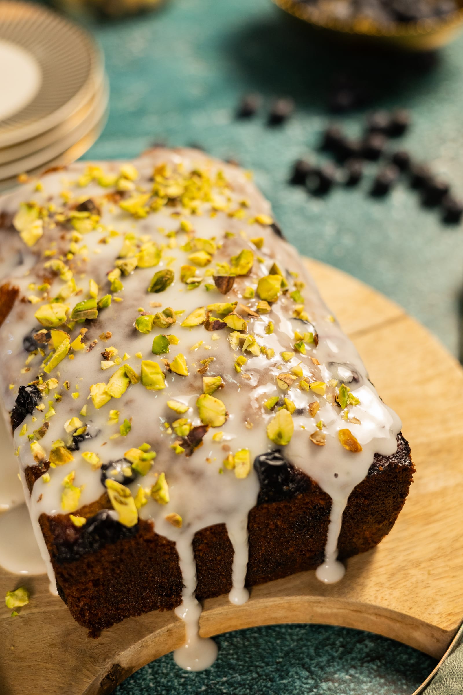 The top of the loaf, glazed and covered in pistachios
