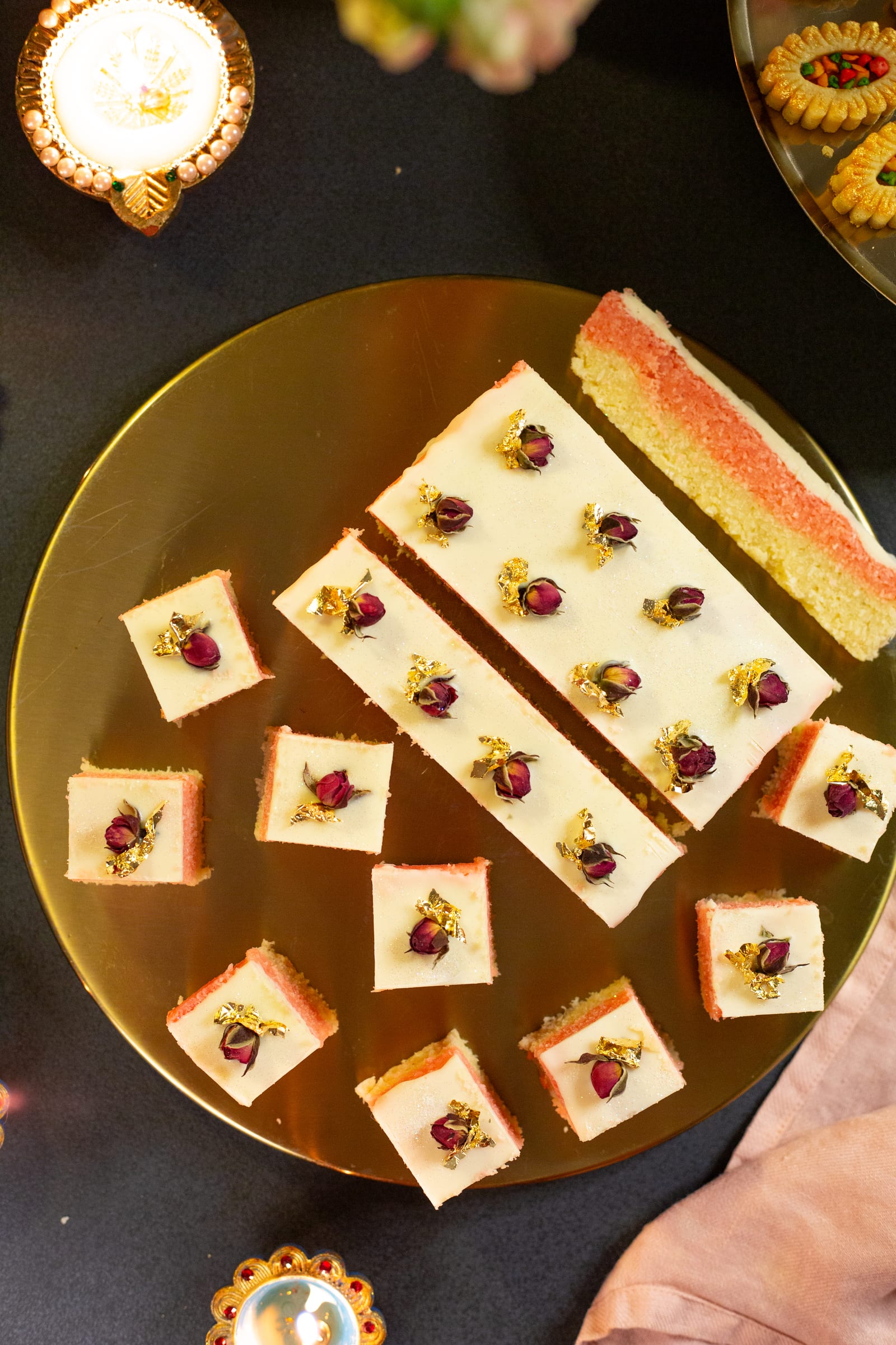 A gold plate of kopra paak strips and cubes, from above