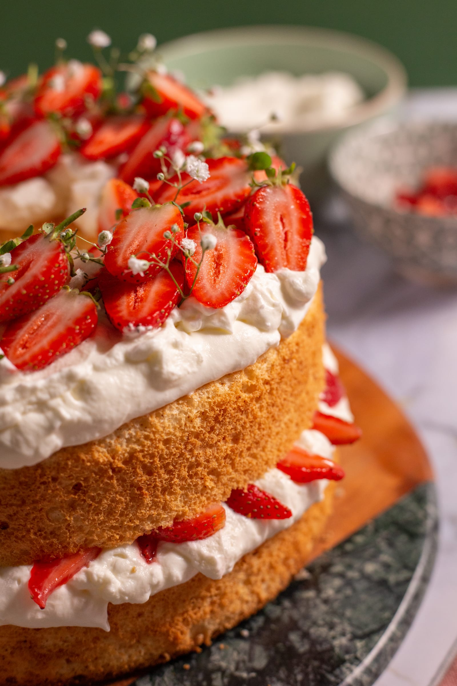 Close-up of the cream and strawberry layers of a strawberry and cream angel food cake