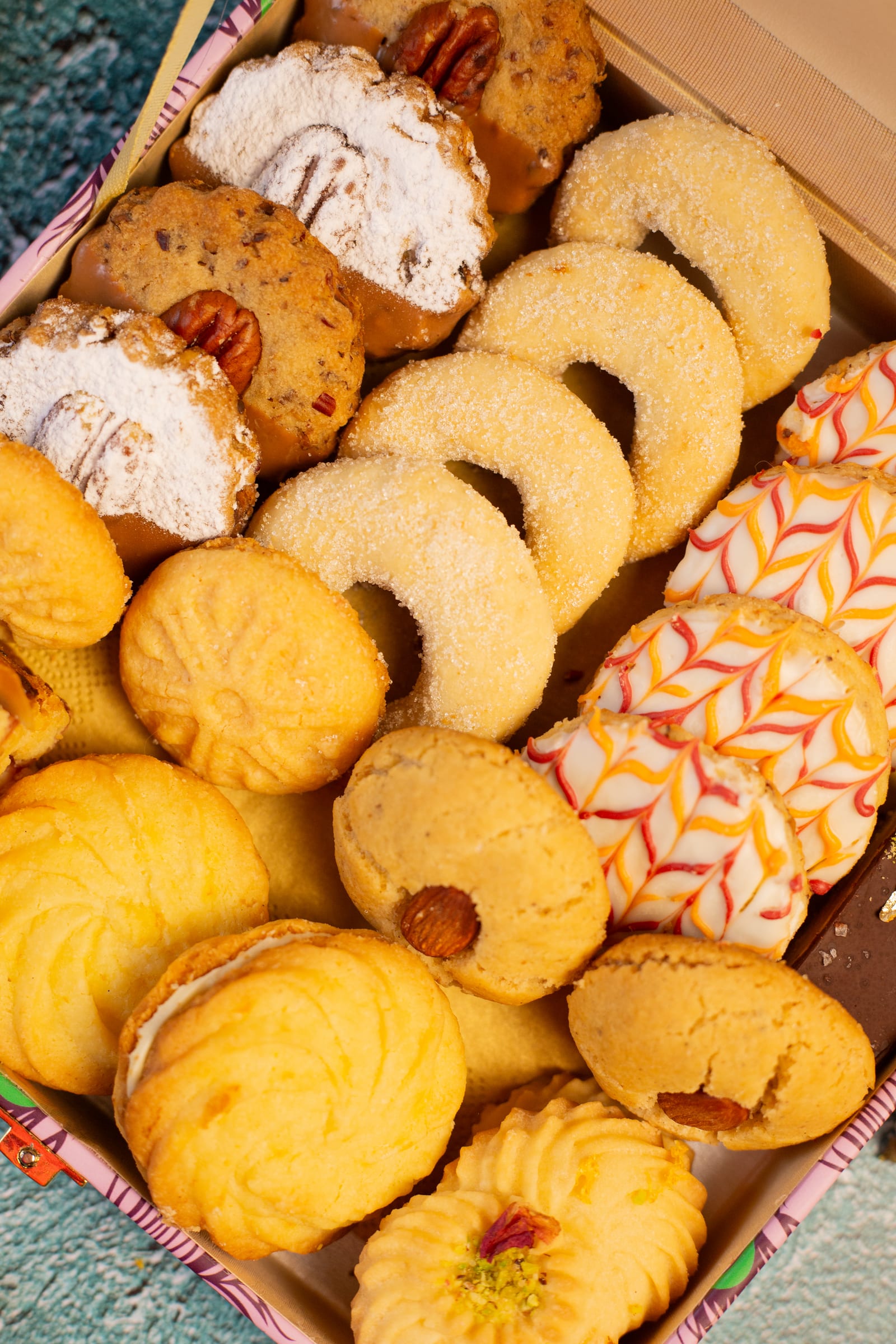 Close-up of a box packed with melting moments, almond biscuits and naan kathai