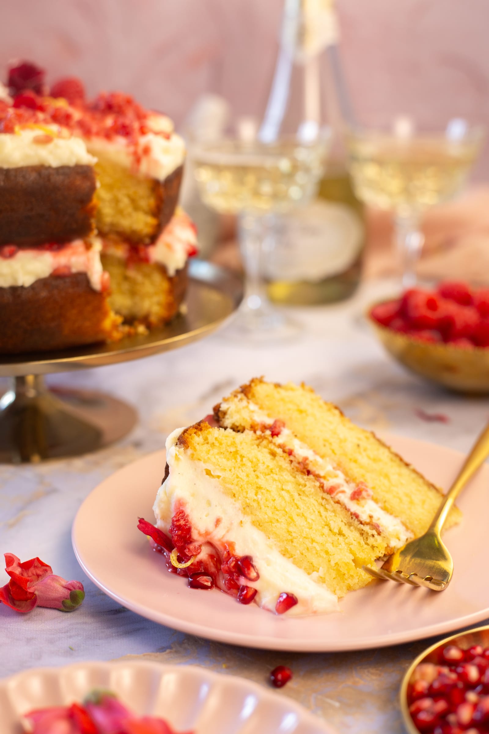 A slice of cake in front of the whole cake