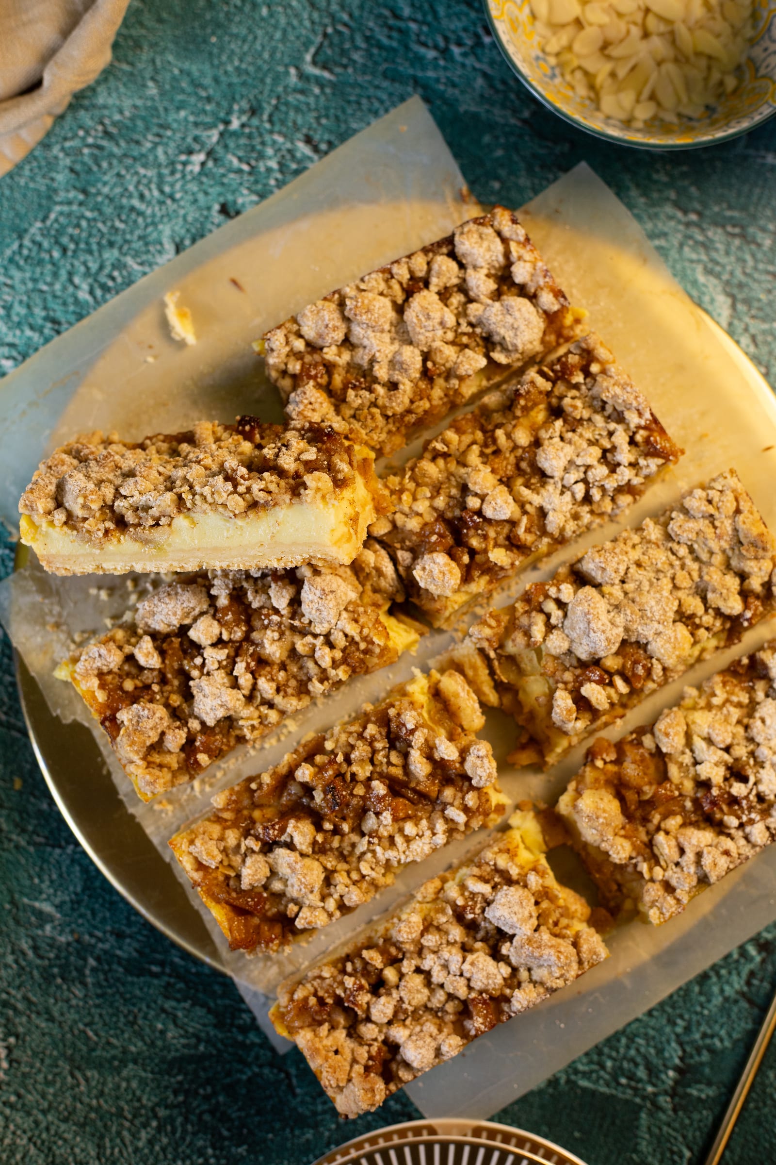Milk tart crumble bars cut into slices, from above