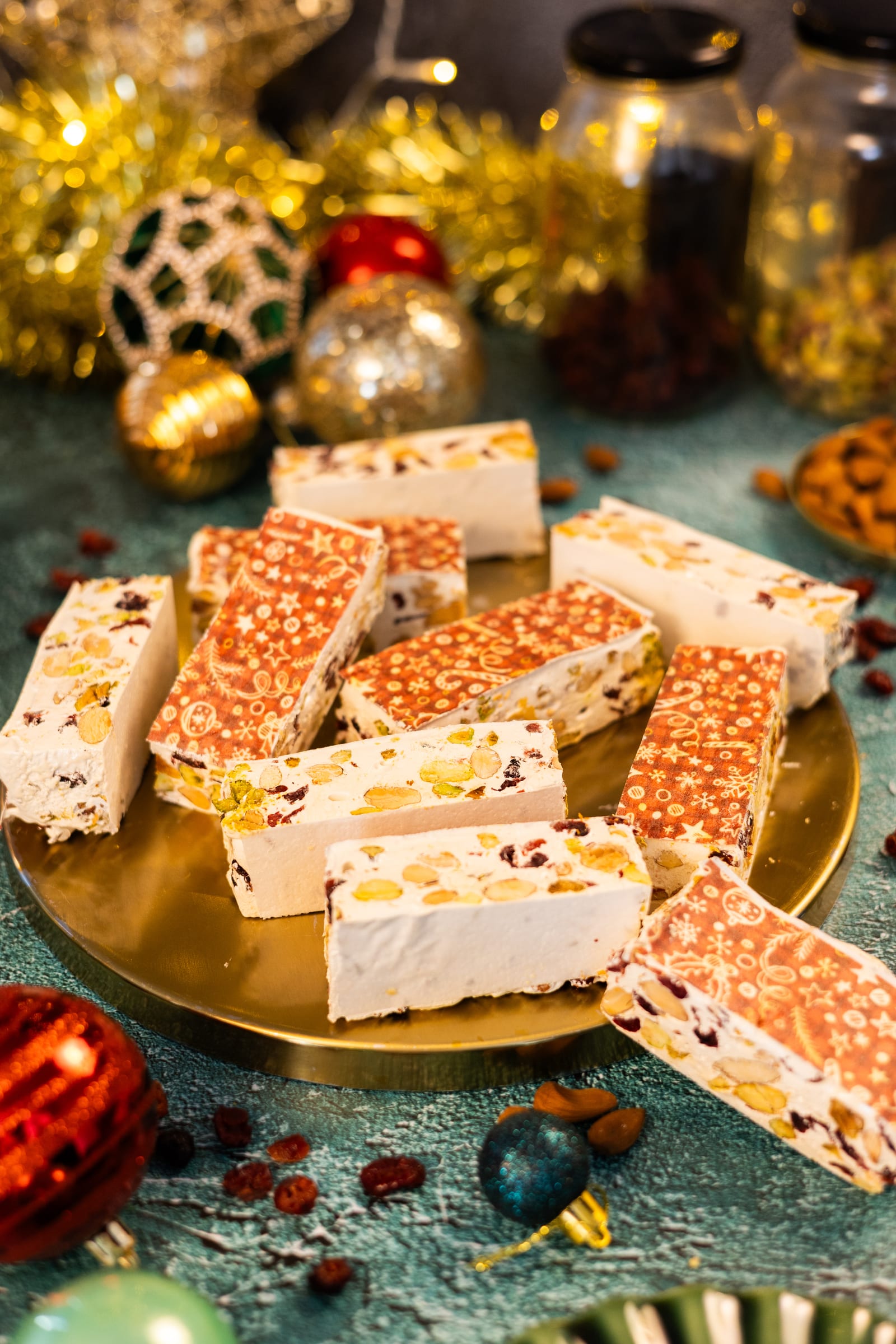 Pieces of nougat cut and piled on a gold plate