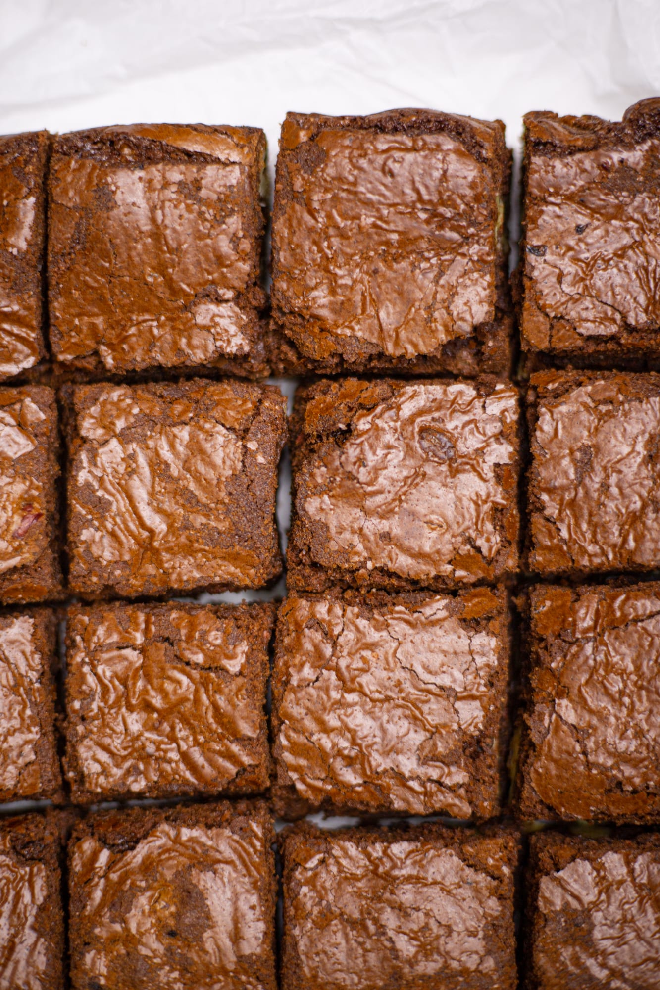 Close-up of chocolate brownies cut into squares, from above