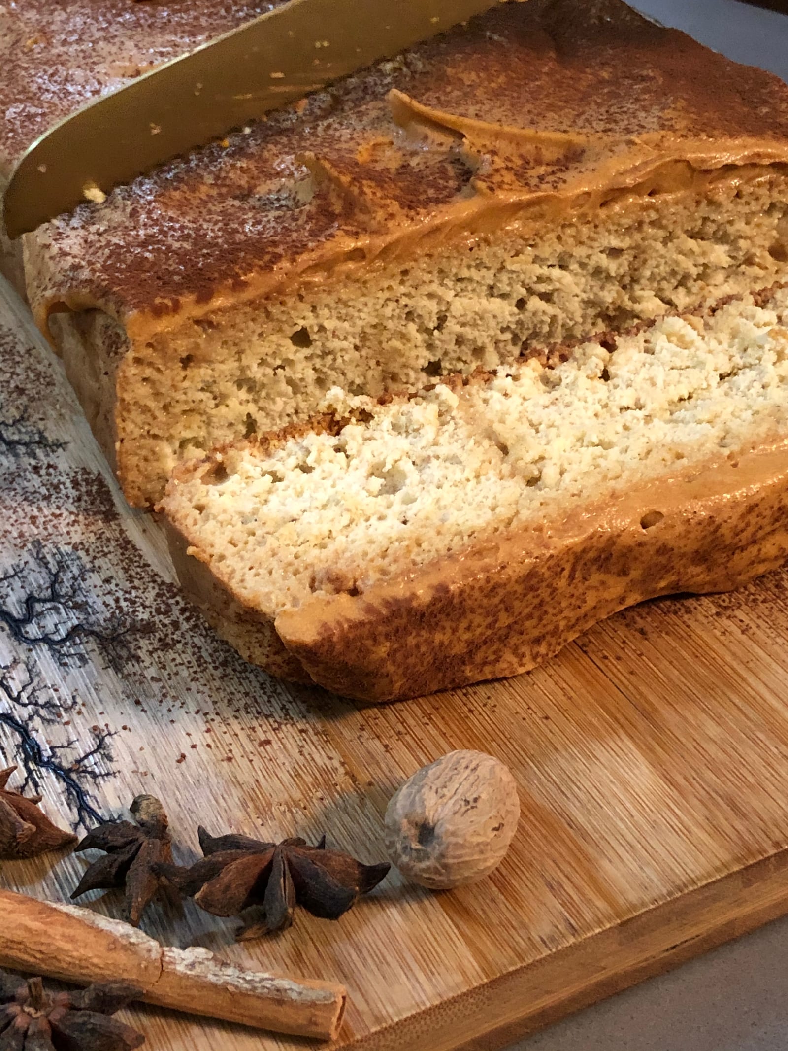 A cut masala tres leches cake showing its pale soaked crumb