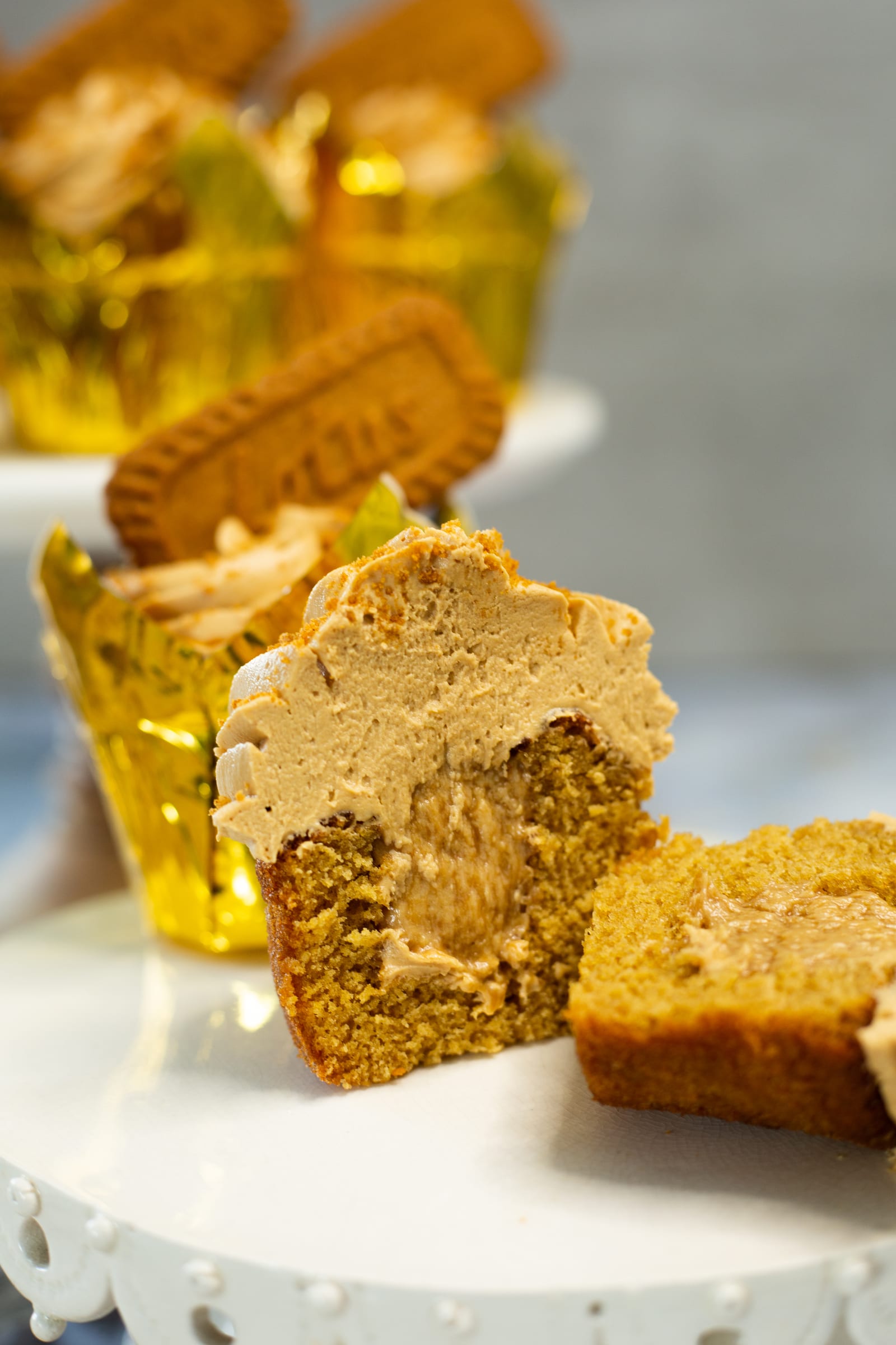 A Biscoff cupcake cut open to show the Biscoff spread filling