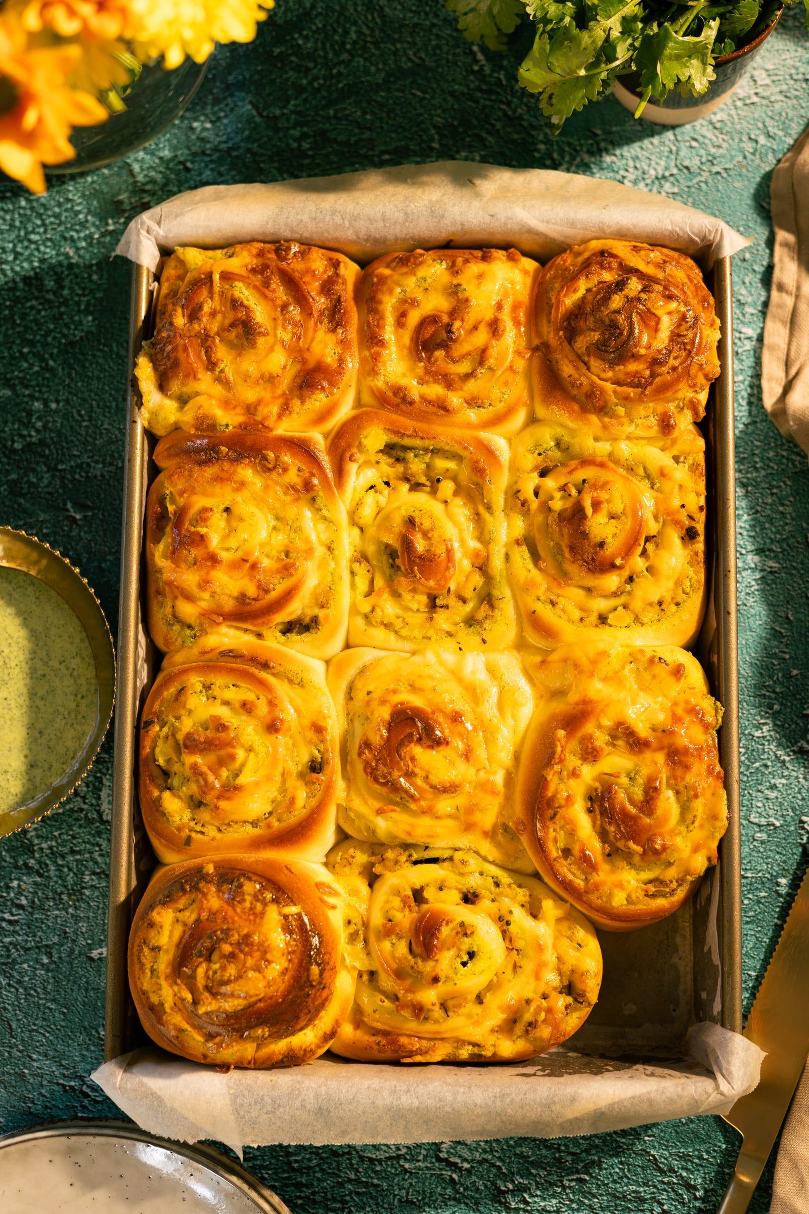 A tray of baked jeera aaloo scrolls, from above