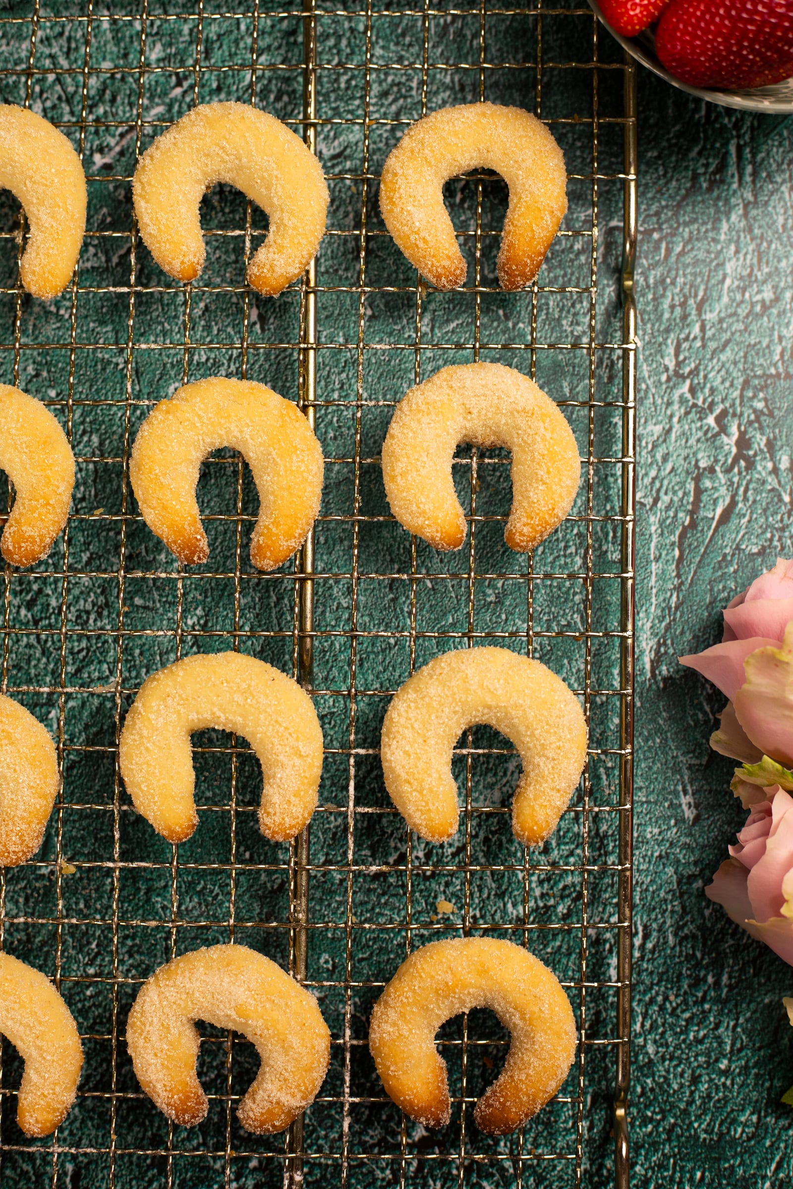 Neat rows of cashew nut crescents on a cooling rack