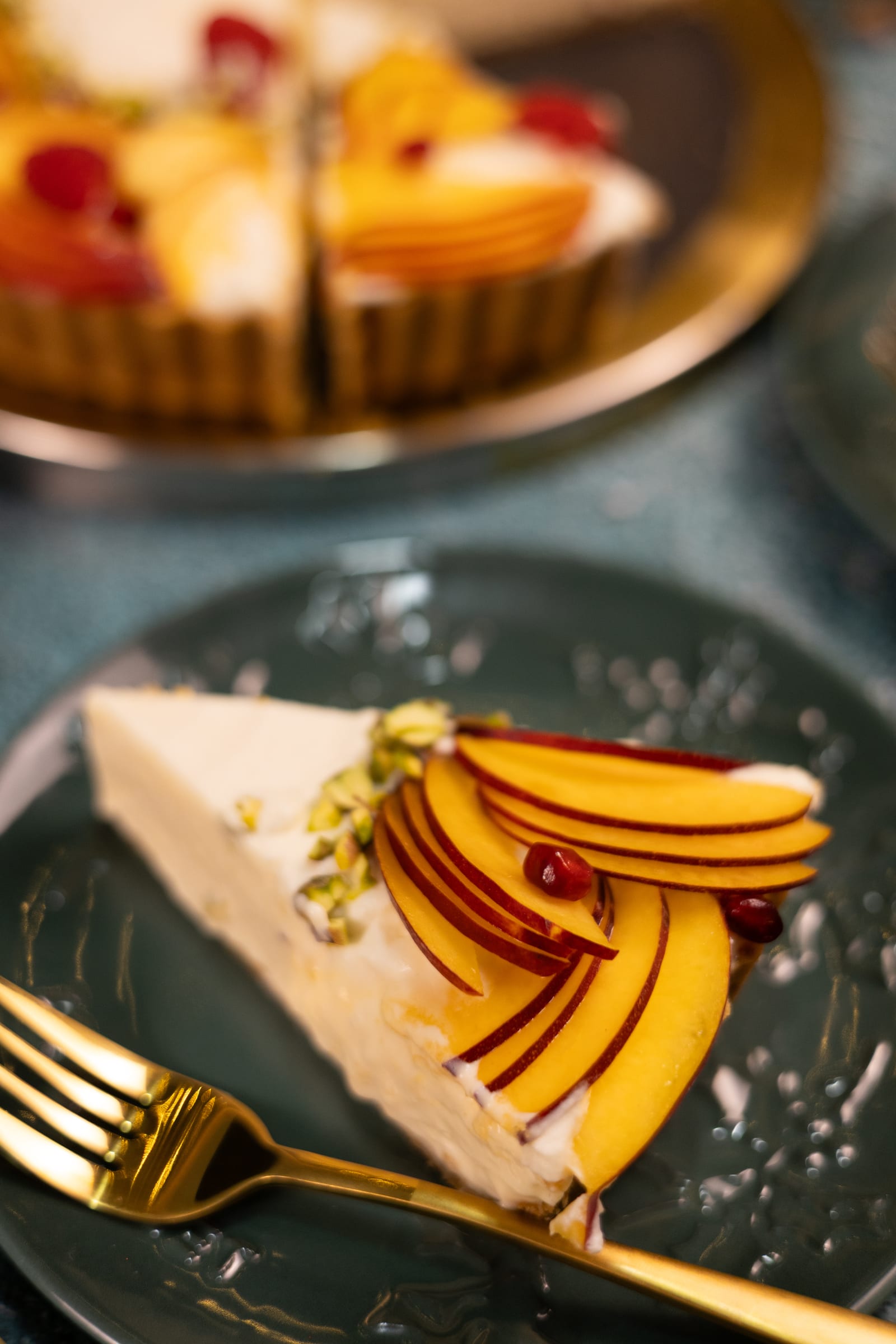 A slice of Cremora tart topped with nectarines