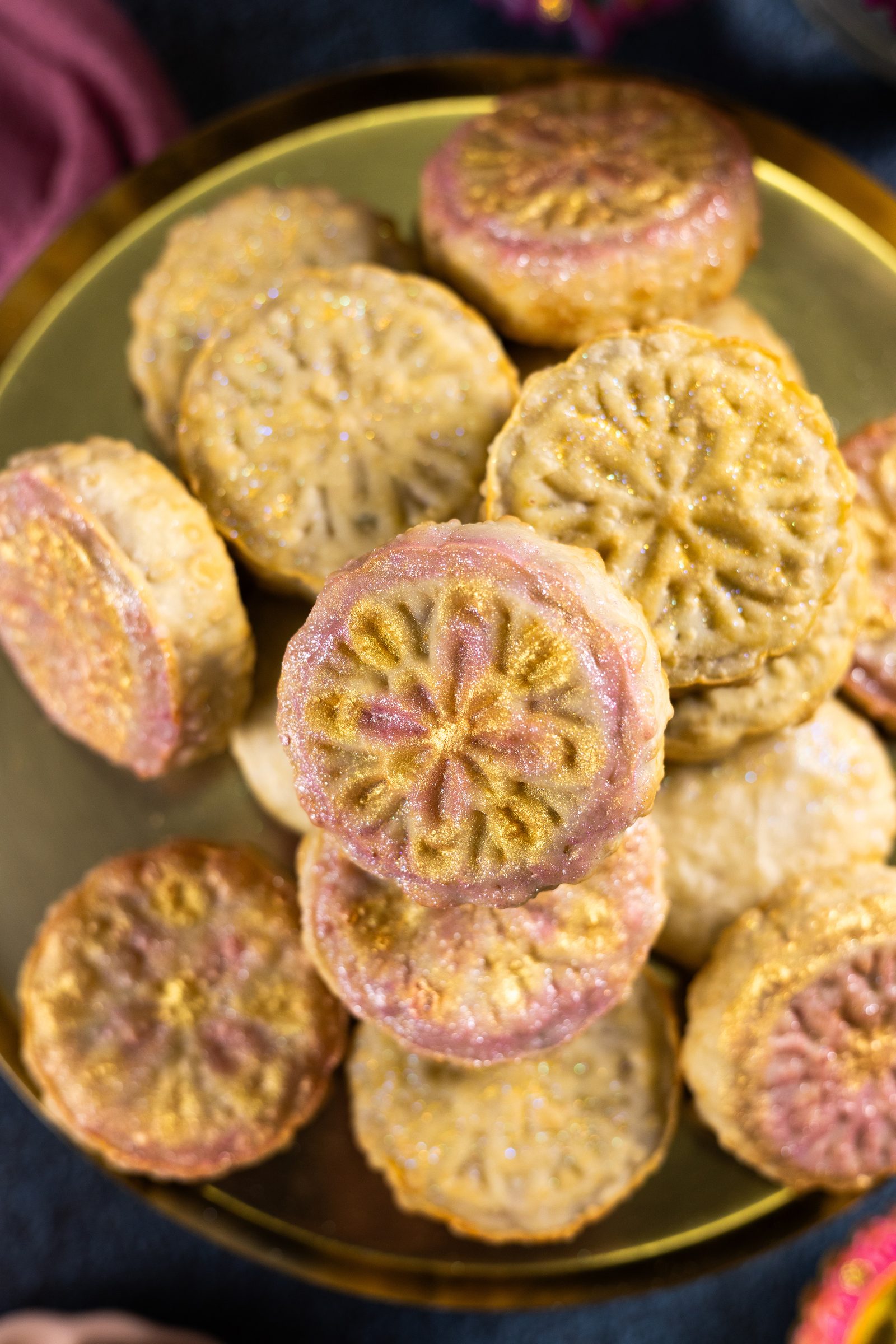 A close-up from above of mawa ghari piled on a brass plate